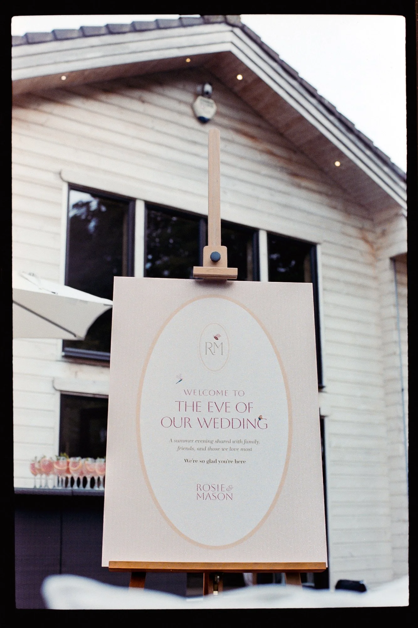 Bespoke wedding welcome sign for a romantic garden wedding, designed by Carrie at Honey Bee Mine. Featuring bespoke monogram and soft blush and peach tones. Captured at Styal Lodge.
