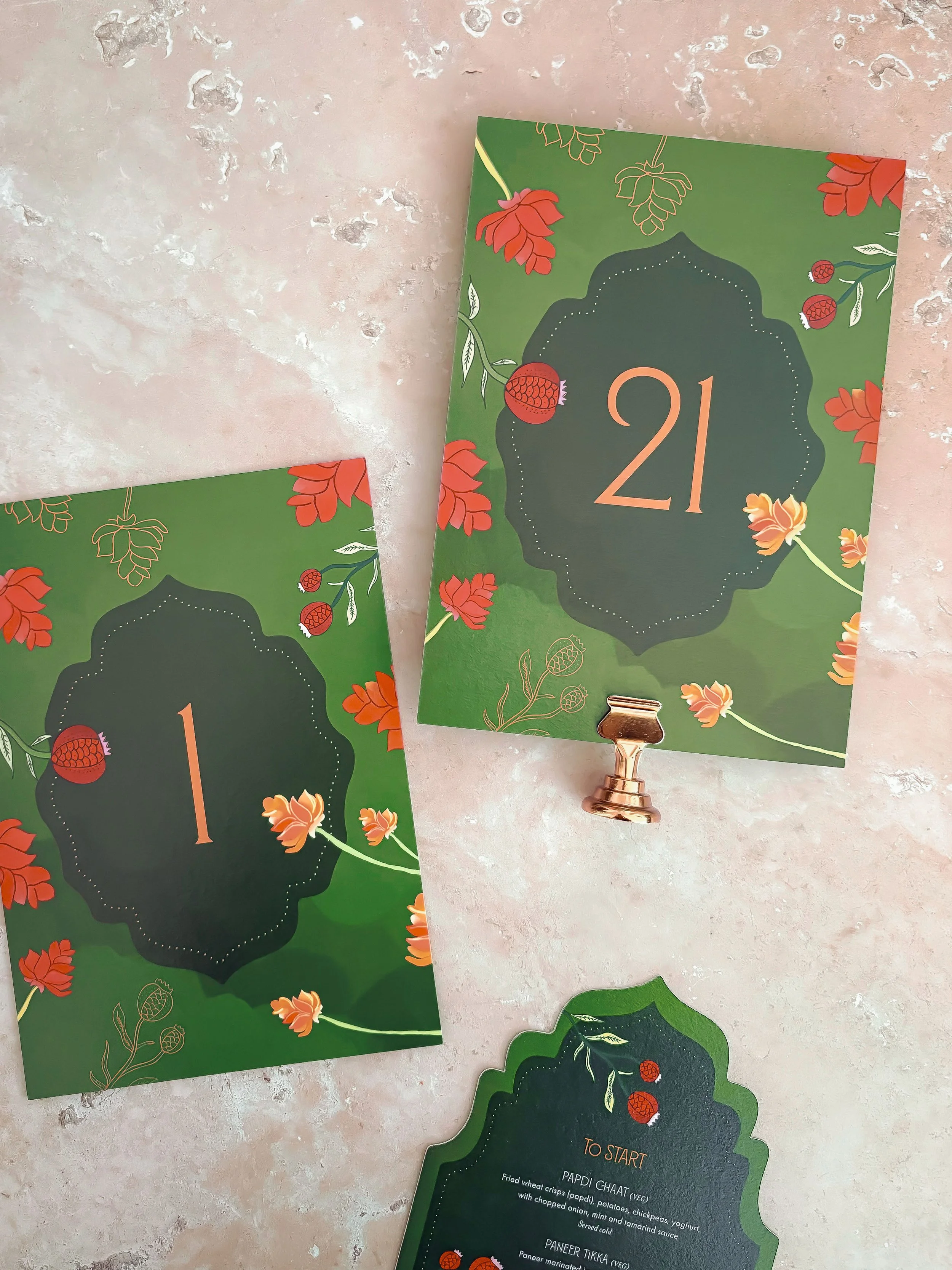 Colourful table numbers designed to coordinate with the wedding stationery