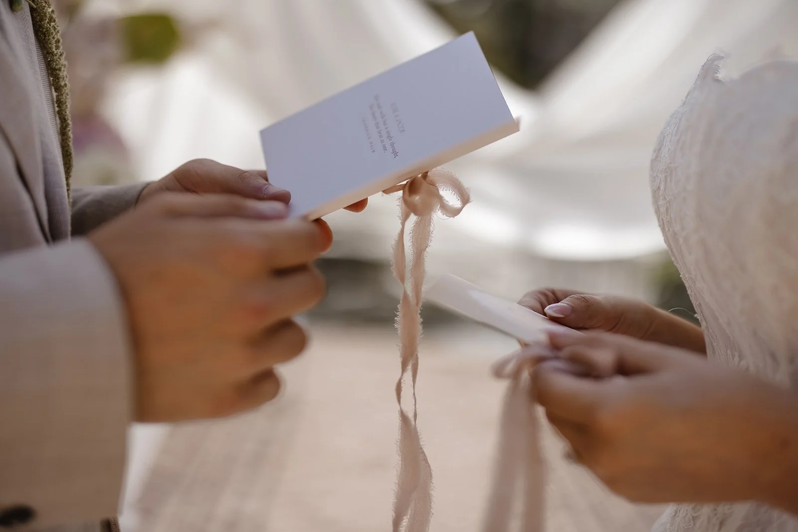 Luxury bespoke wedding vow books, featuring bespoke swan monogram, soft blush tones, and pure silk ribbon. Designed by Carrie at Honey Bee Mine, and captured at Capesthorne Hall.