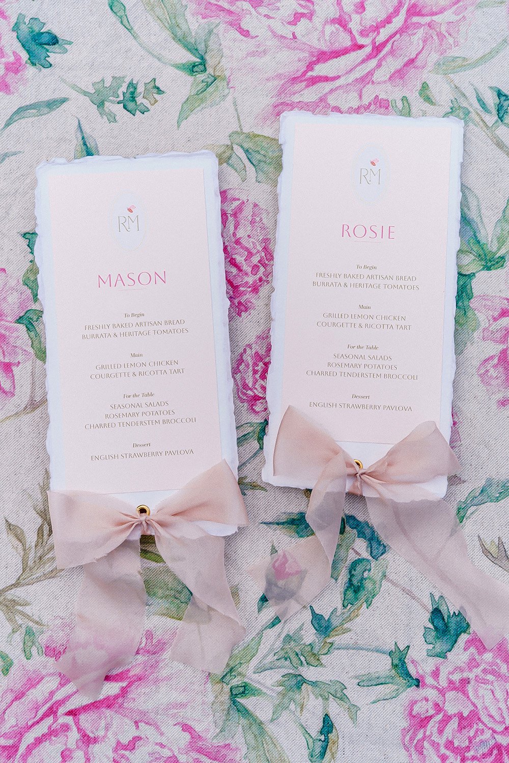 Romantic summer garden bespoke wedding menus designed by Carrie at Honey Bee Mine. Featuring deckled handmade paper, bespoke monogram, guest names, and blush tones. Finished with delicate silk chiffon ribbon. Captured at Styal Lodge.