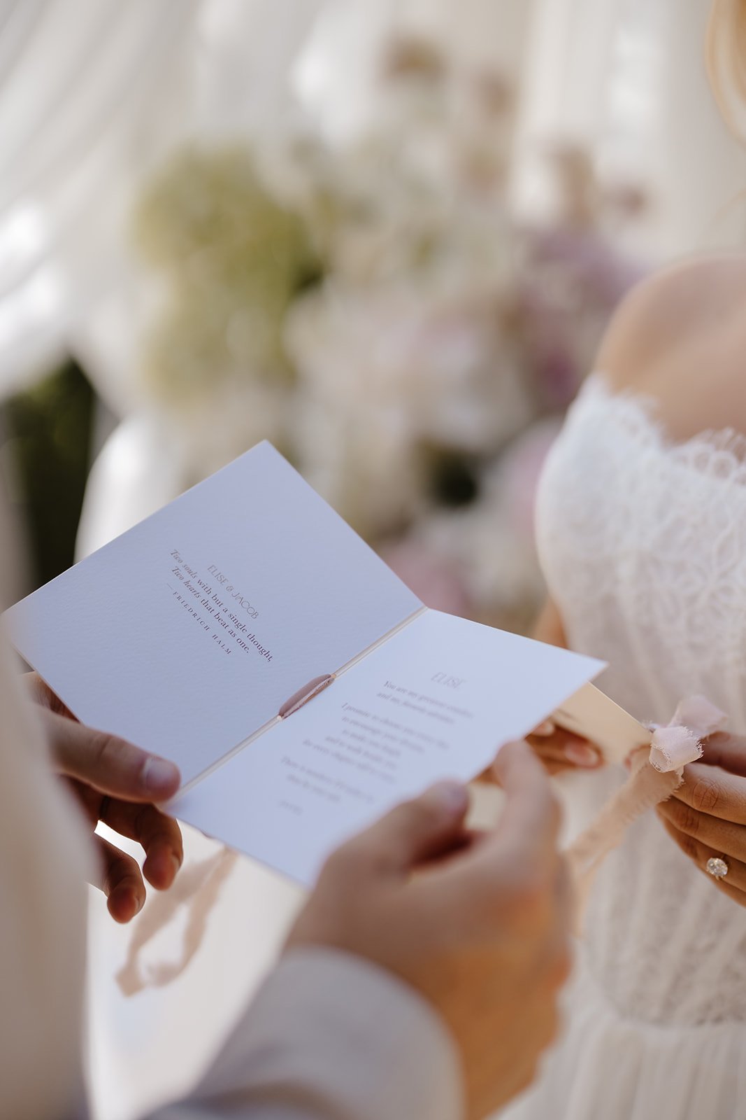 Luxury bespoke wedding vow books, featuring bespoke swan monogram, soft blush tones, and pure silk ribbon. Designed by Carrie at Honey Bee Mine, and captured at Capesthorne Hall.