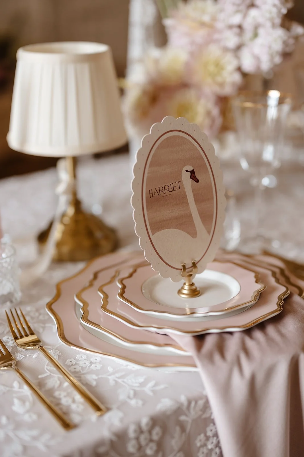 Luxury double-side wedding menus and place cards, featuring hand illustrated swan, soft blush tones, die-cut scalloped edges, and personalised with guest names. Designed by Carrie at Honey Bee Mine, and captured at Capesthorne Hall.