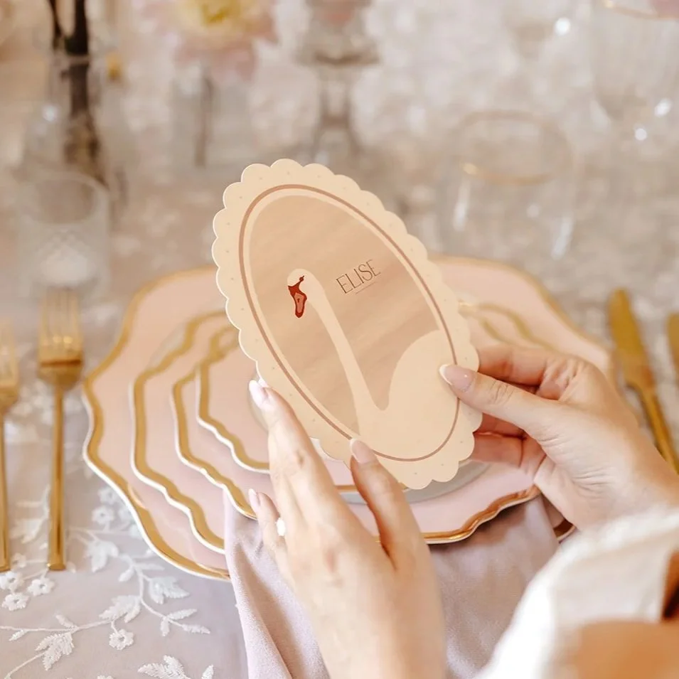 Luxury double-side wedding menus and place cards, featuring hand illustrated swan, soft blush tones, die-cut scalloped edges, and personalised with guest names. Designed by Carrie at Honey Bee Mine, and captured at Capesthorne Hall.