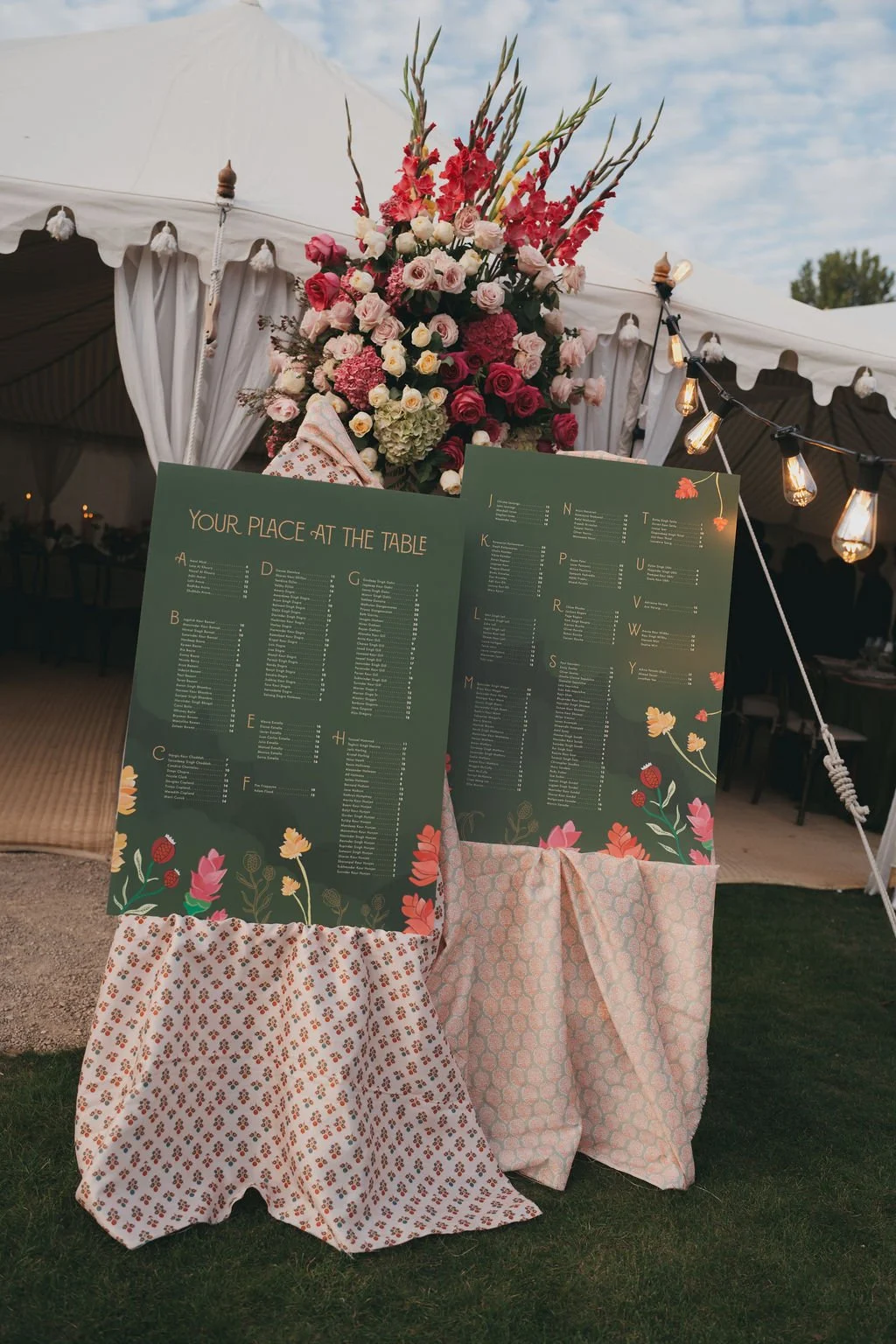 Large-format wedding signage with colourful botanical artwork at Kin House