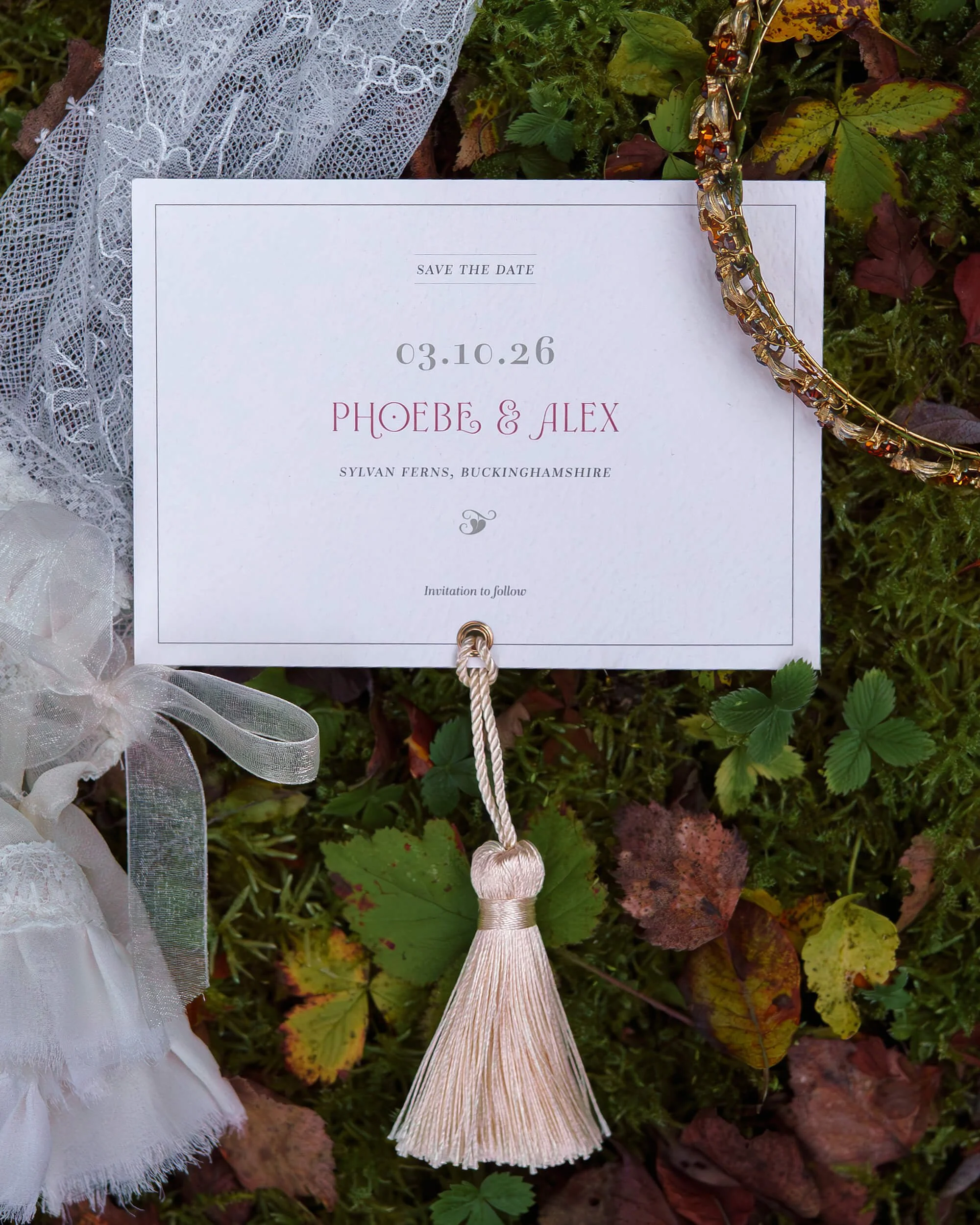 Luxury ivory and forest green wedding invitation suite with botanical details and die-cut shapes.