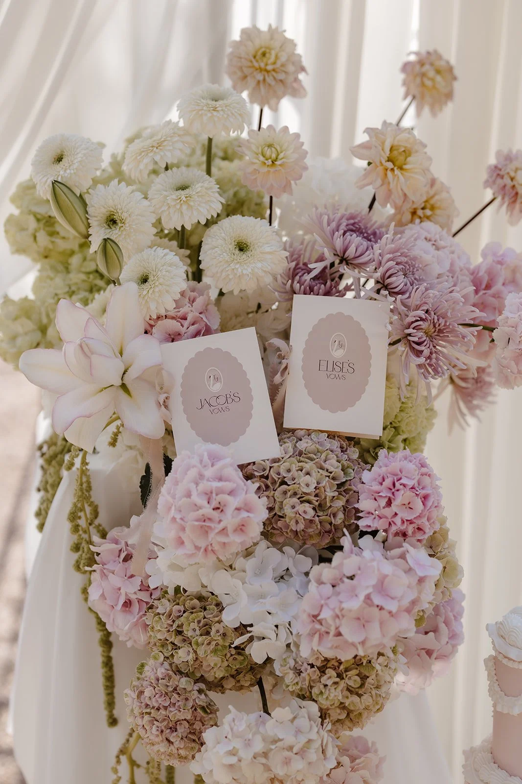 Luxury bespoke wedding vow books, featuring bespoke swan monogram, soft blush tones, and pure silk ribbon. Designed by Carrie at Honey Bee Mine, and captured at Capesthorne Hall.