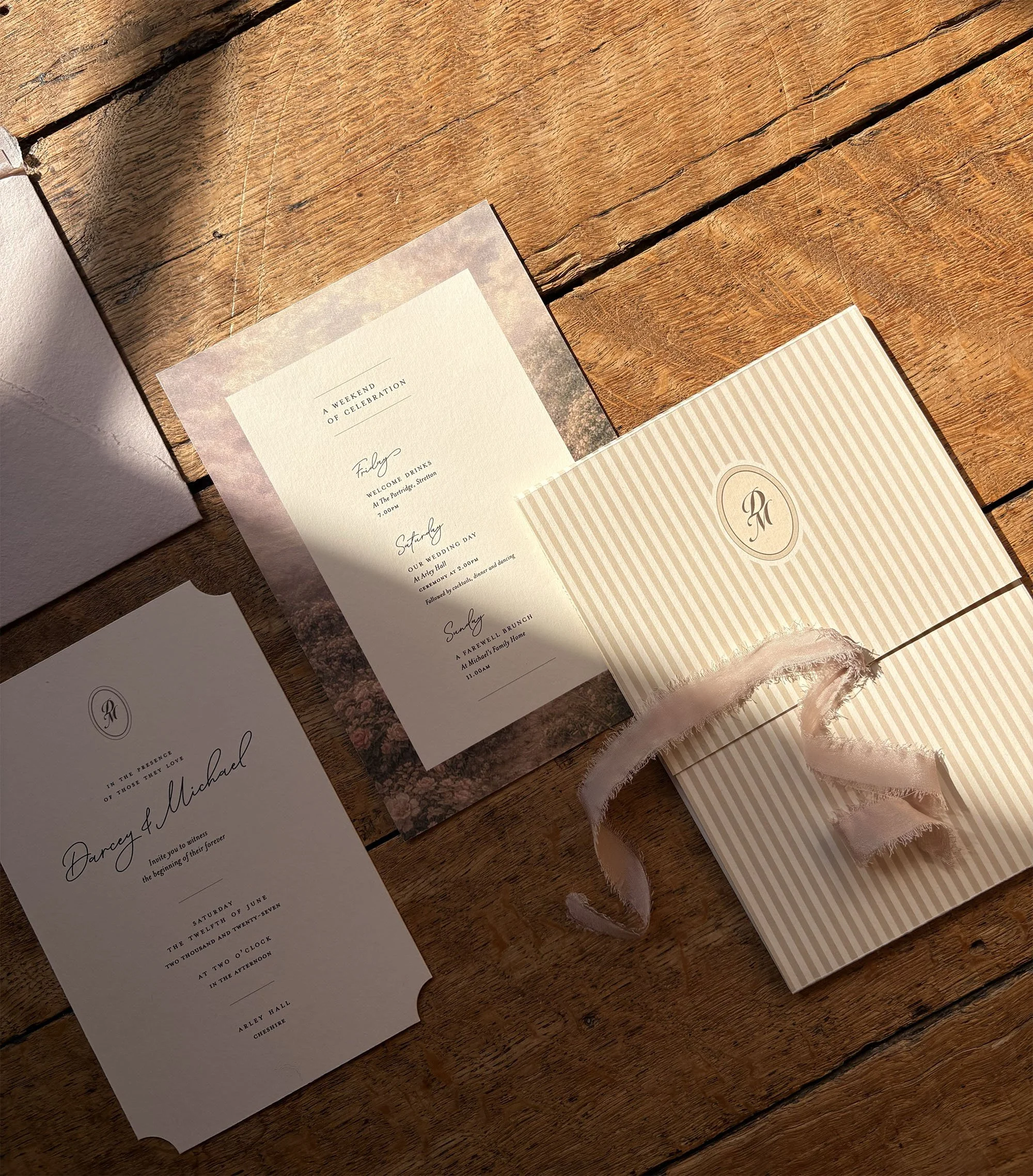 Luxury rose and ivory wedding stationery at Arley Hall & Gardens, featuring die-cut invitations, striped details and vintage rose ribbon by Honey Bee Mine.