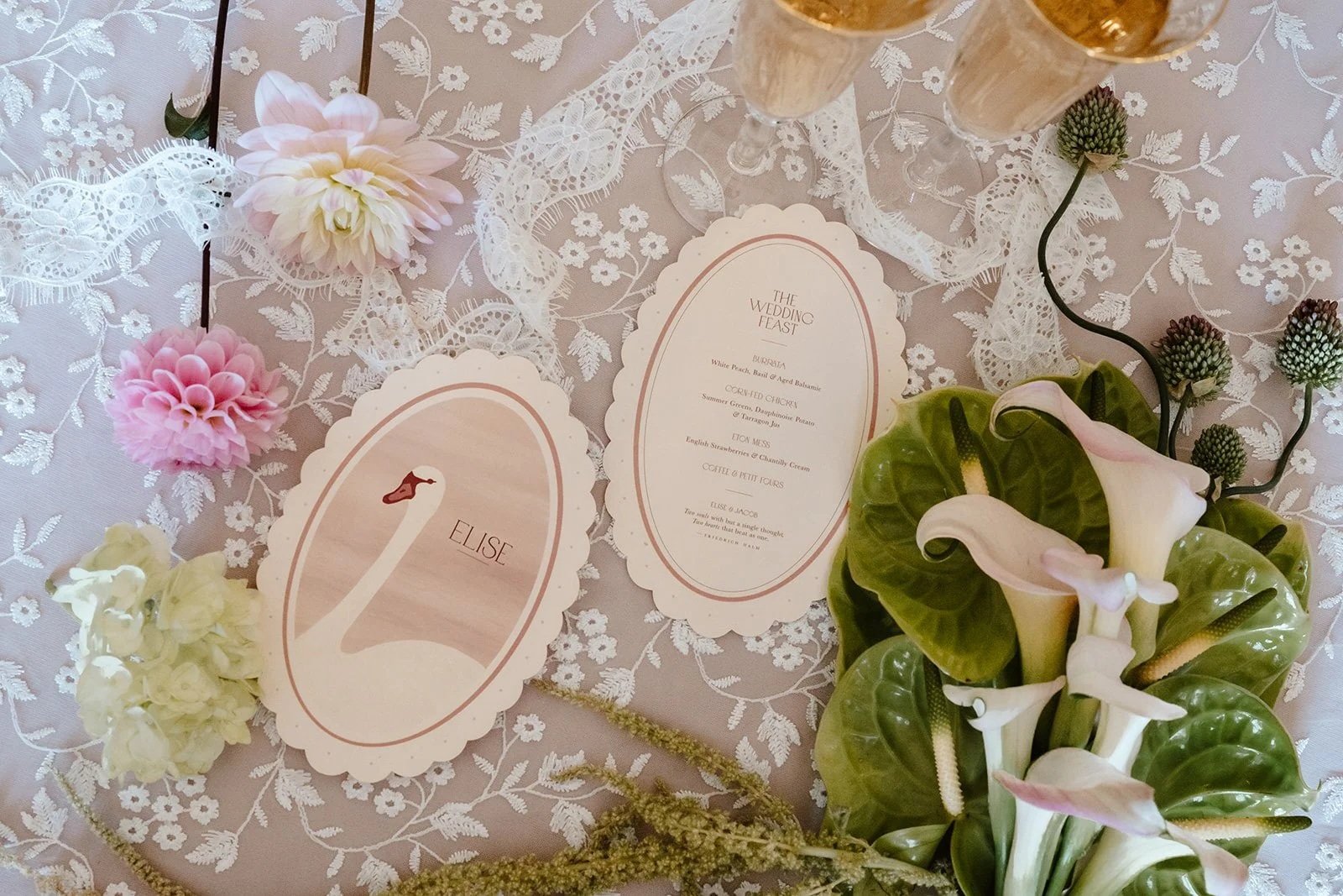 Luxury double-side wedding menus and place cards, featuring hand illustrated swan, soft blush tones, die-cut scalloped edges, and personalised with guest names. Designed by Carrie at Honey Bee Mine, and captured at Capesthorne Hall.
