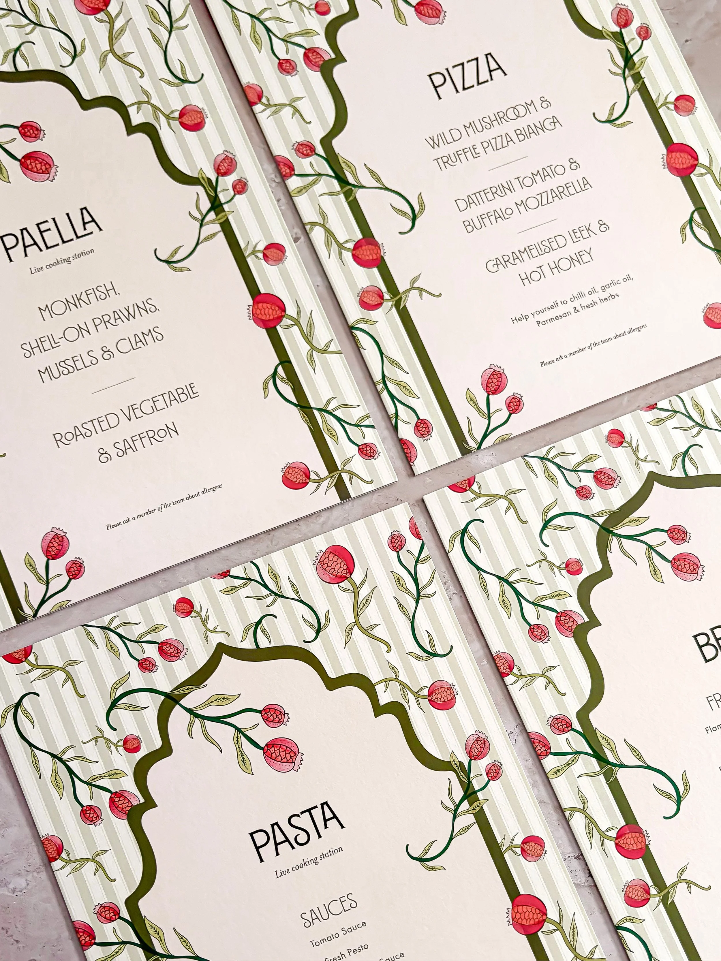 Colourful wedding reception food station signs with bespoke floral and botanical details.