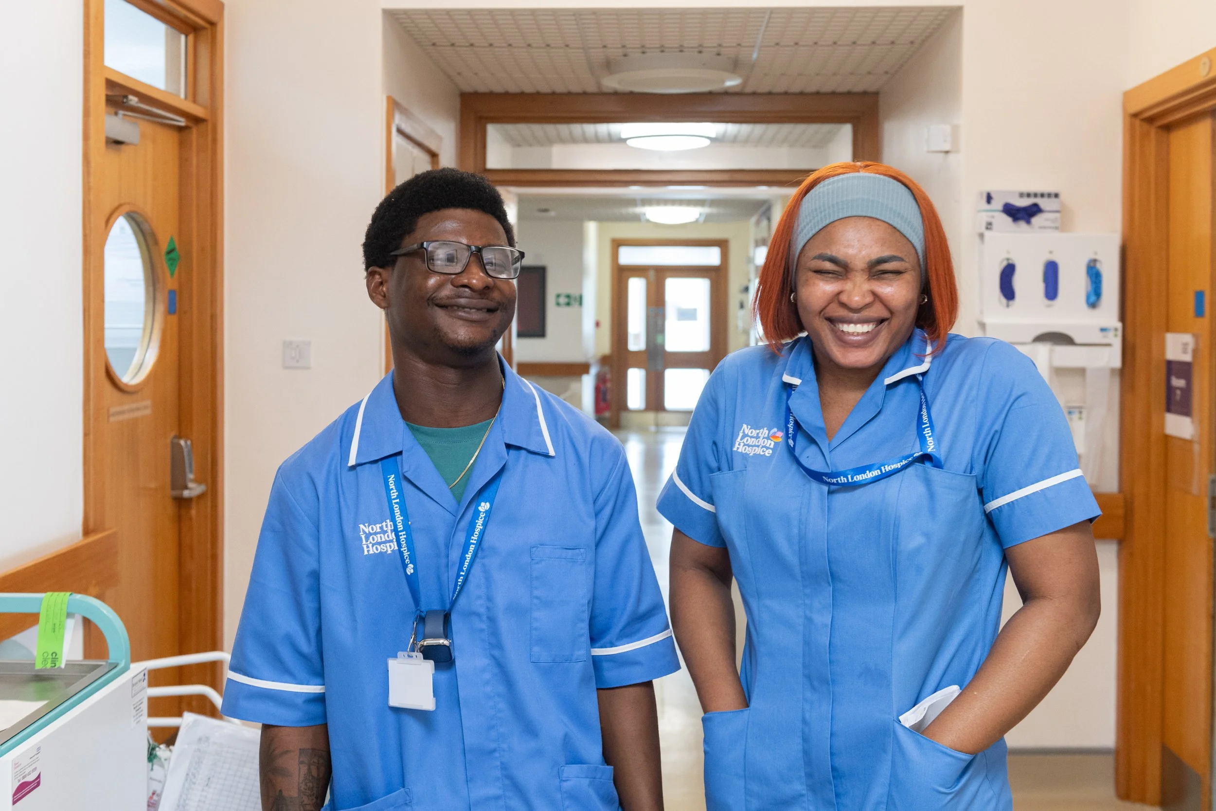 Cares poses with happy smiles in IPU corridor