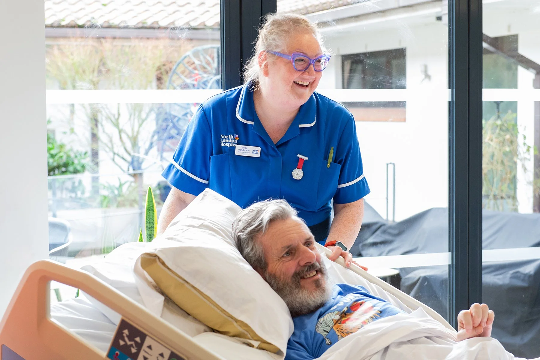 Nurse and impatient sharing a smile
