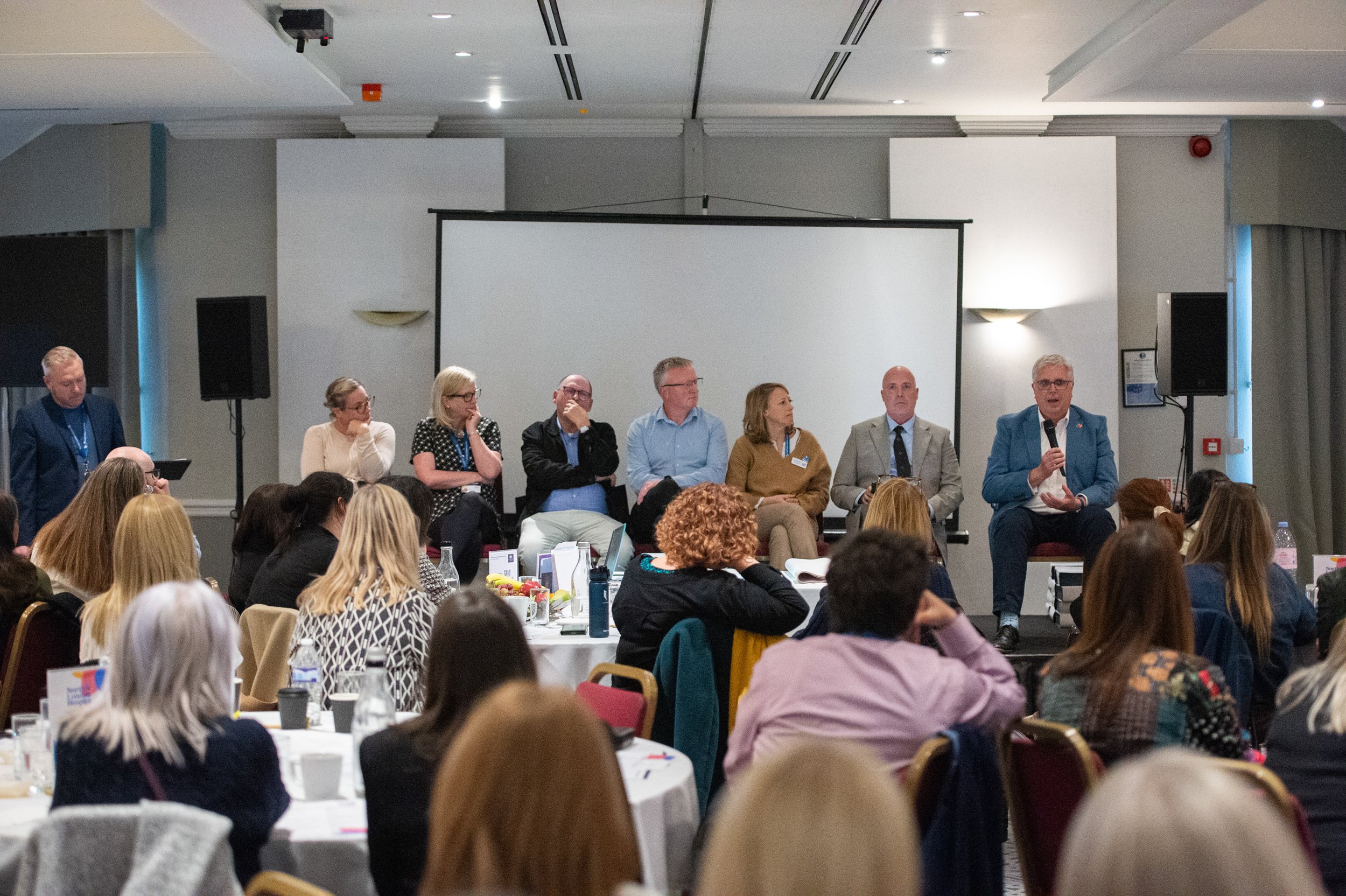 Senior management and trustees address conference