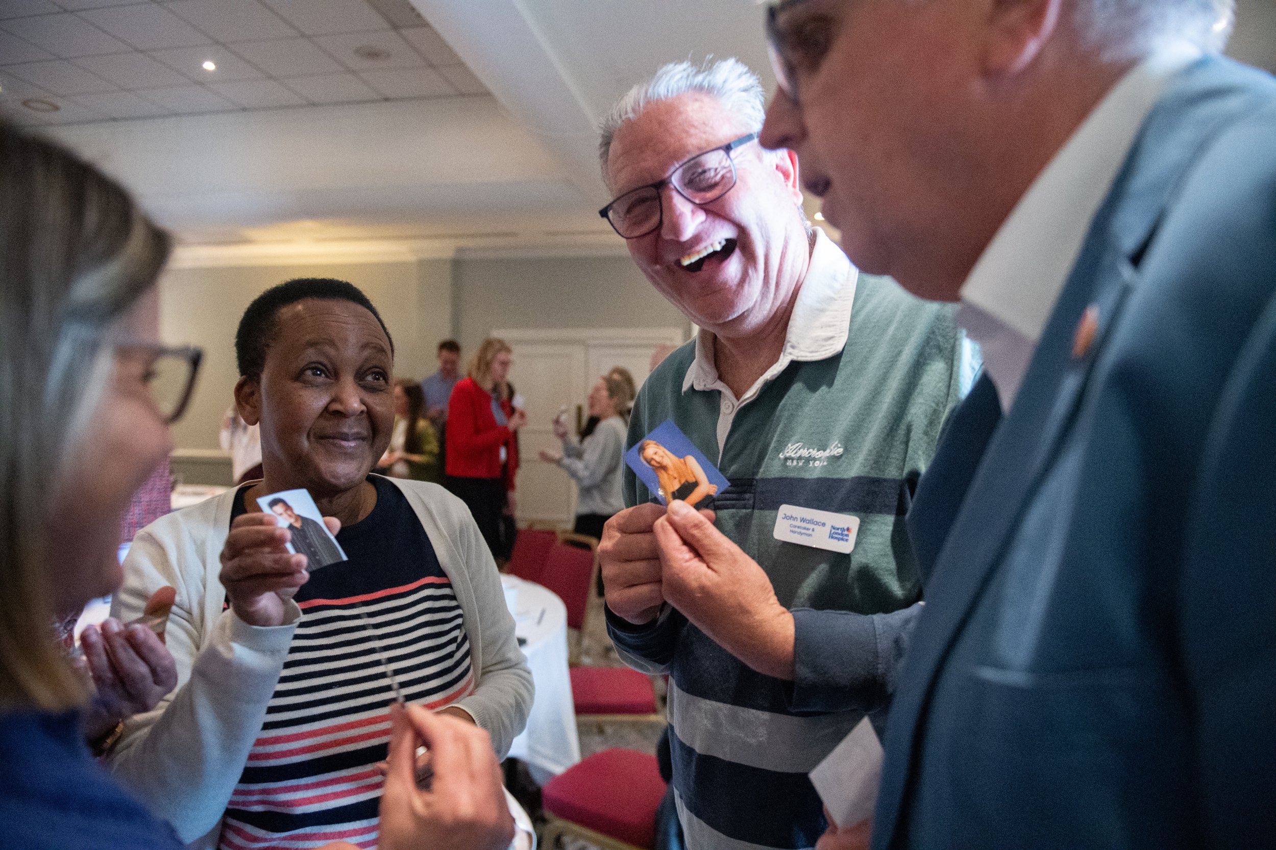 A smiling group of attendees gather together as part of group bonding session