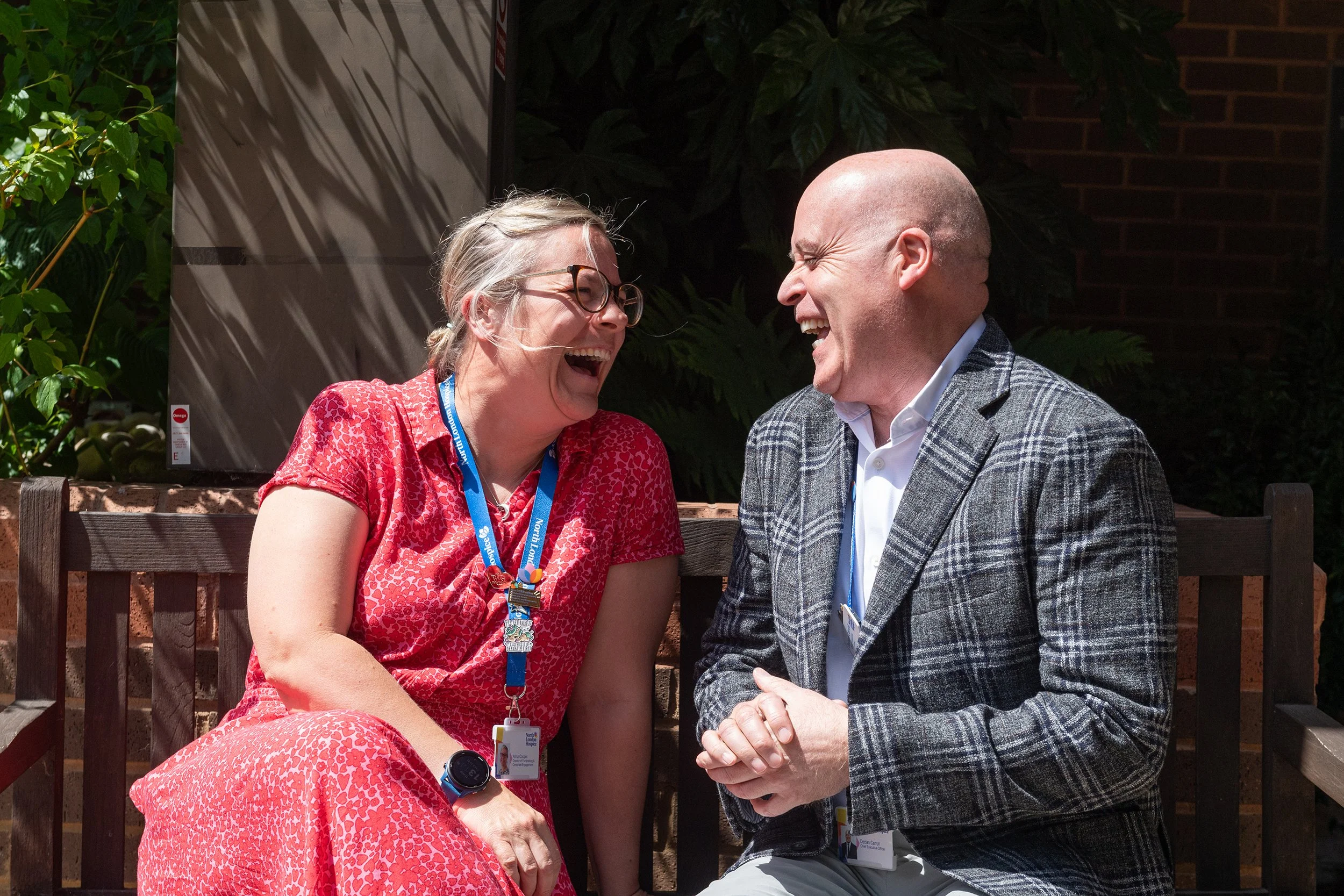 Director and CEO sharing a laugh outside