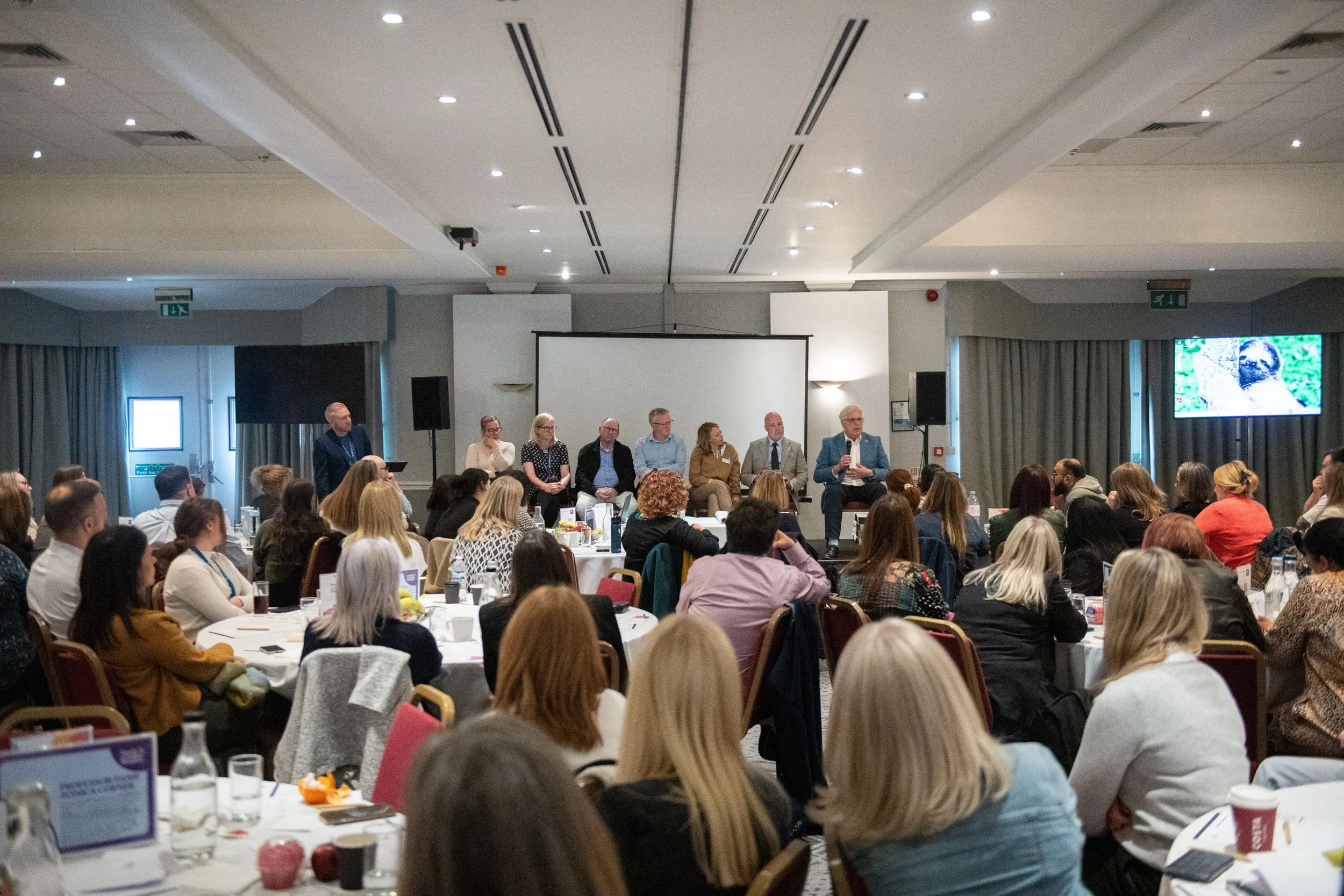 Senior management and trustees address conference