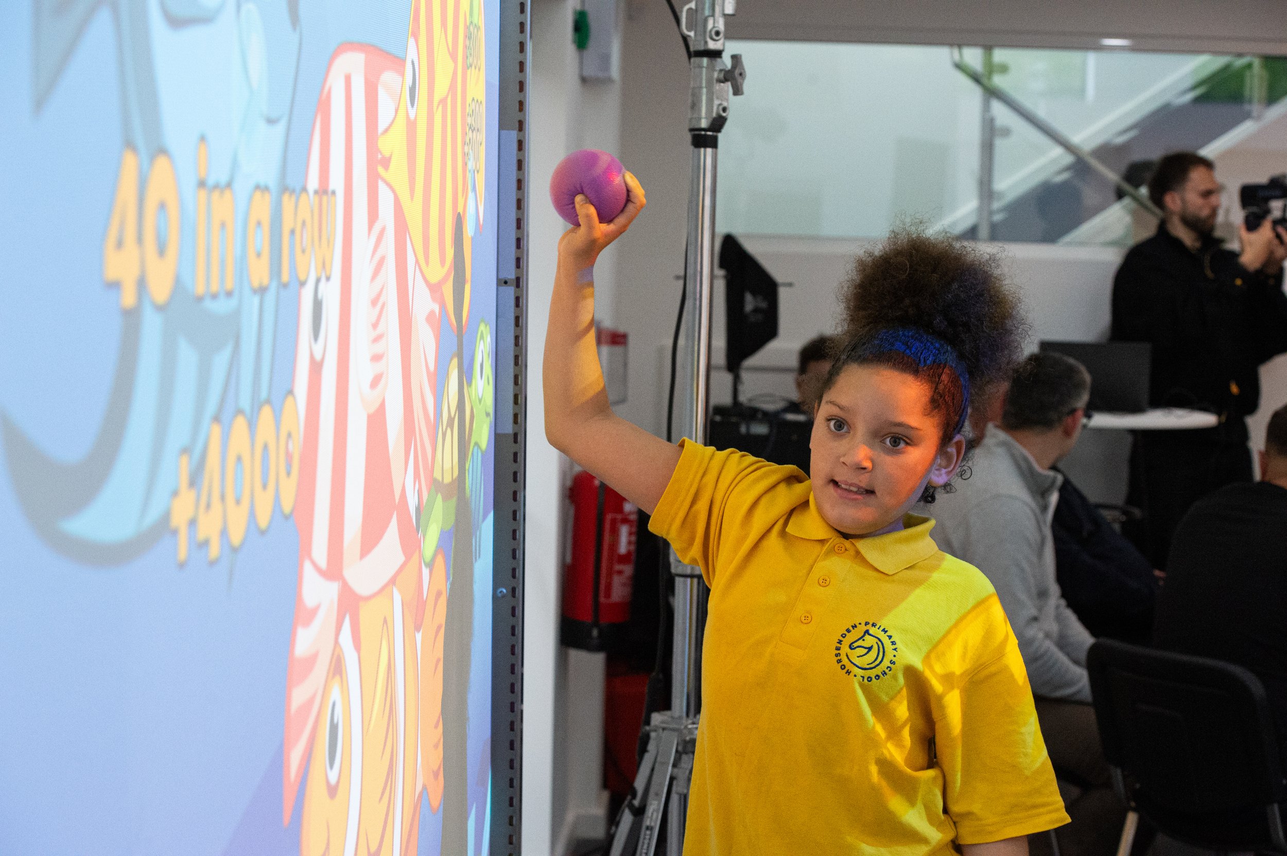 Pupil plays with sensory wall