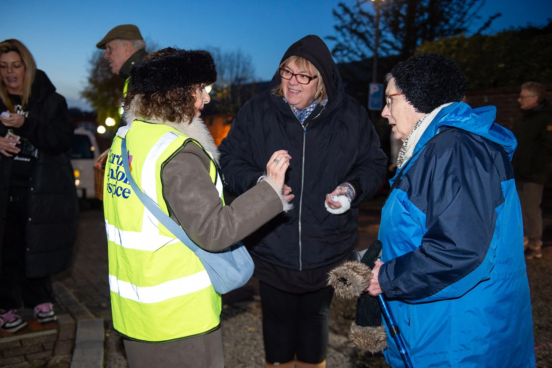 Volunteer and guests having a discussion 
