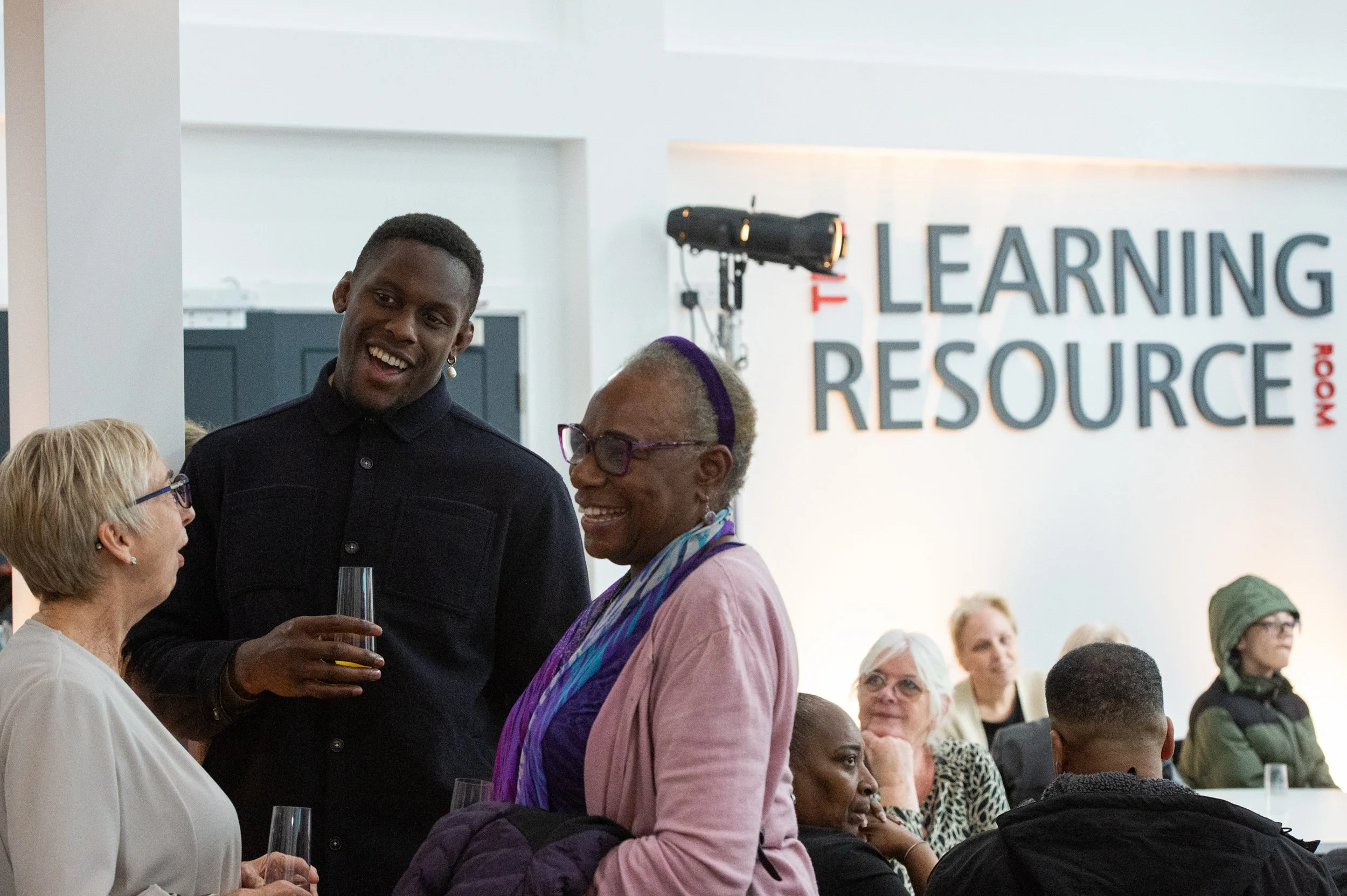 England and British & Irish Lions rugby captain Maro Itoje talks to guests