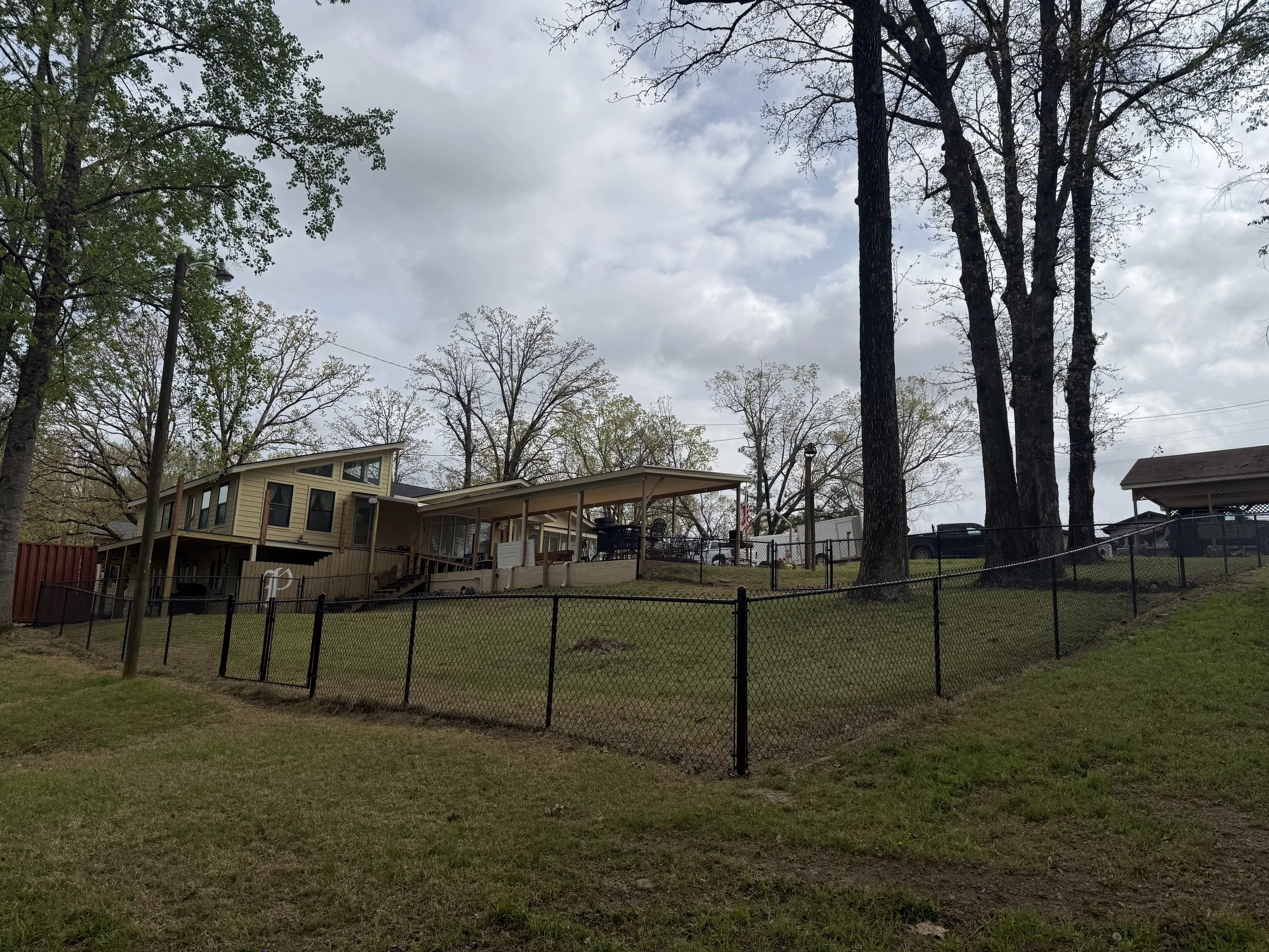 Black chain link fence installed in Hernando, MS by DeSoto Fence Co.