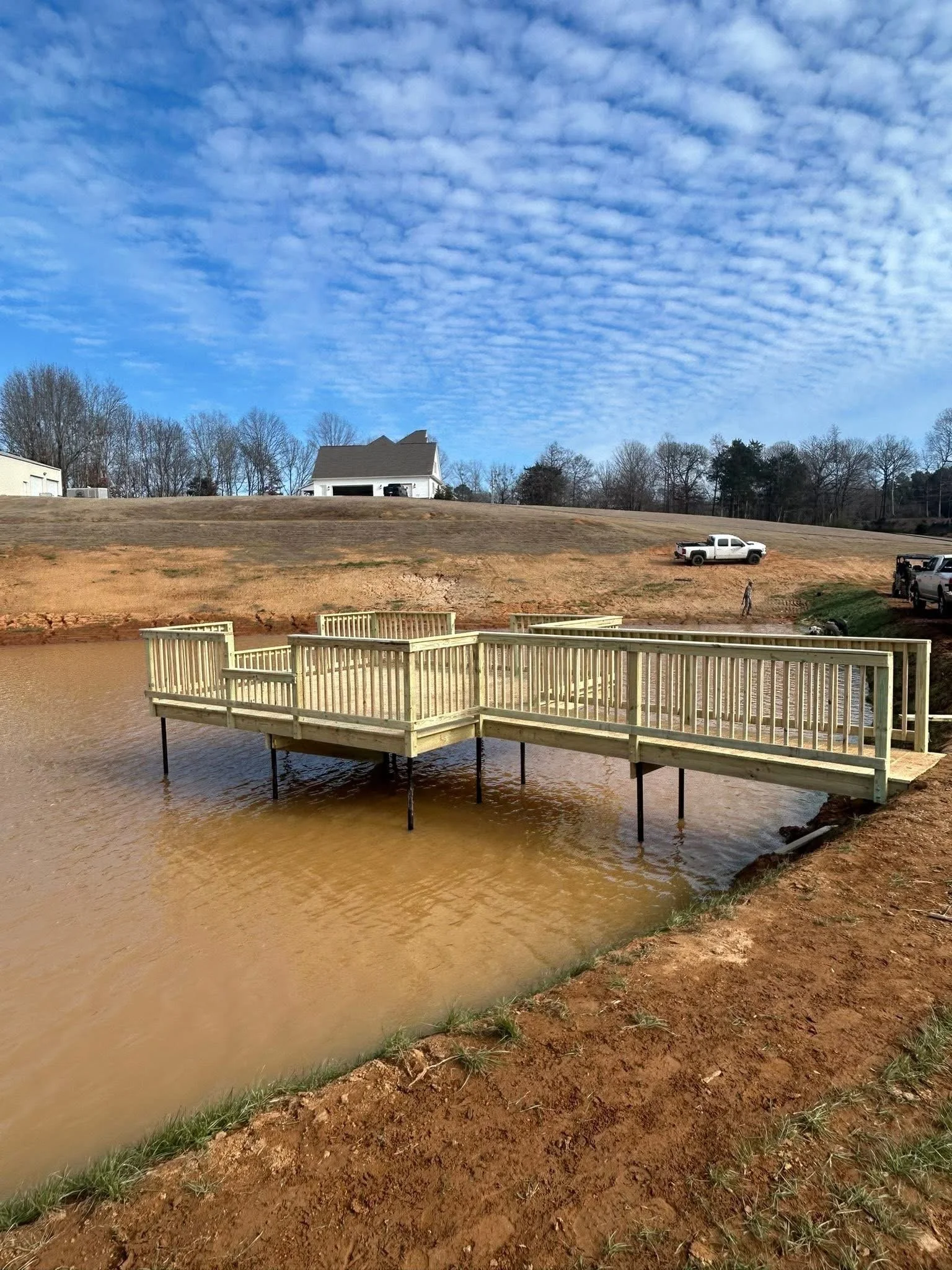 Pressure Treated Floating Dock in Hernando, Mississippi by DeSoto Fence Co. featuring waterfront access, custom railings, and durable dock construction designed for recreation, fishing, and long term performance.