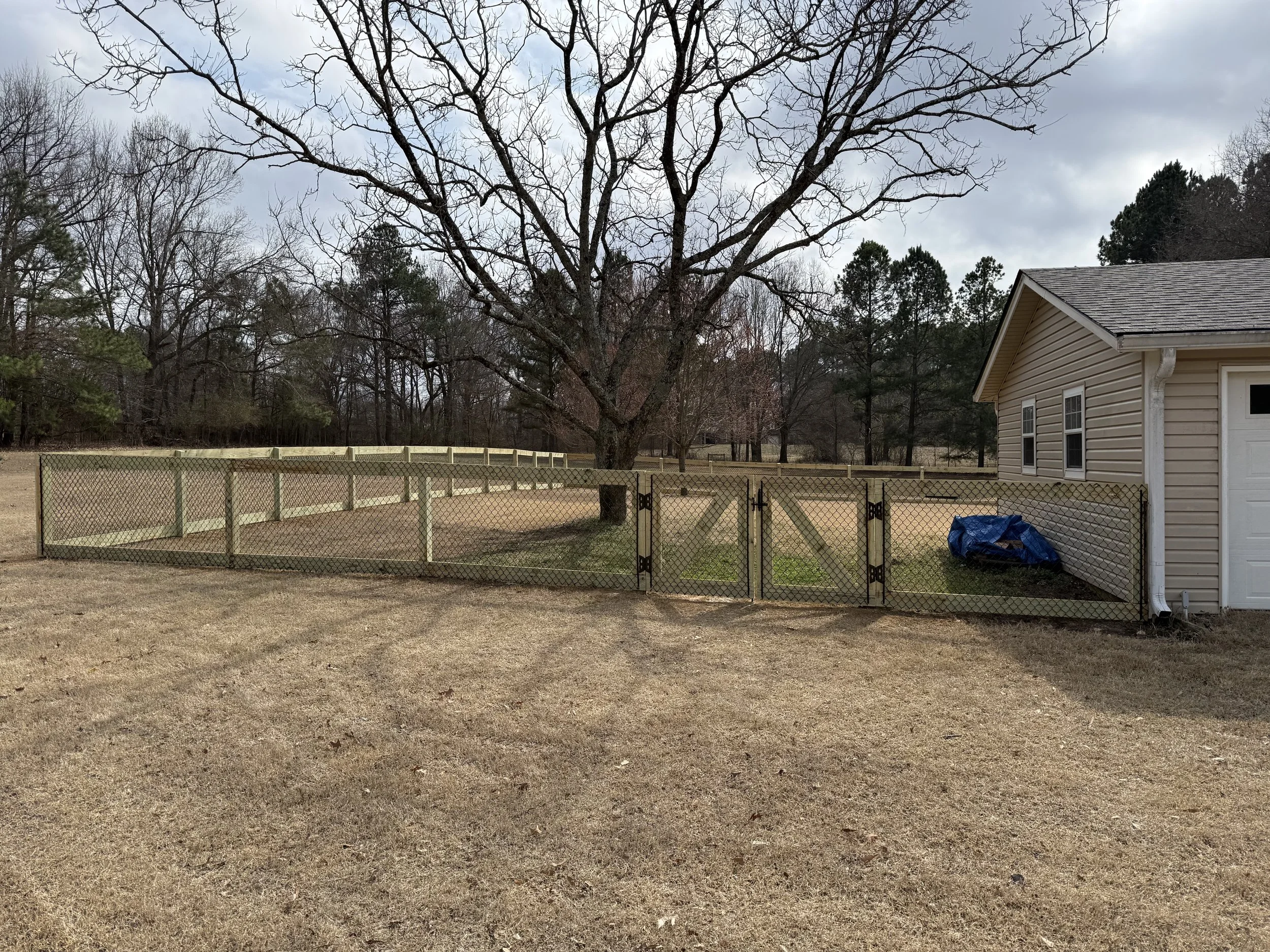 California style chain link fence with custom double gate installed in Hernando, MS by DeSoto Fence Co.