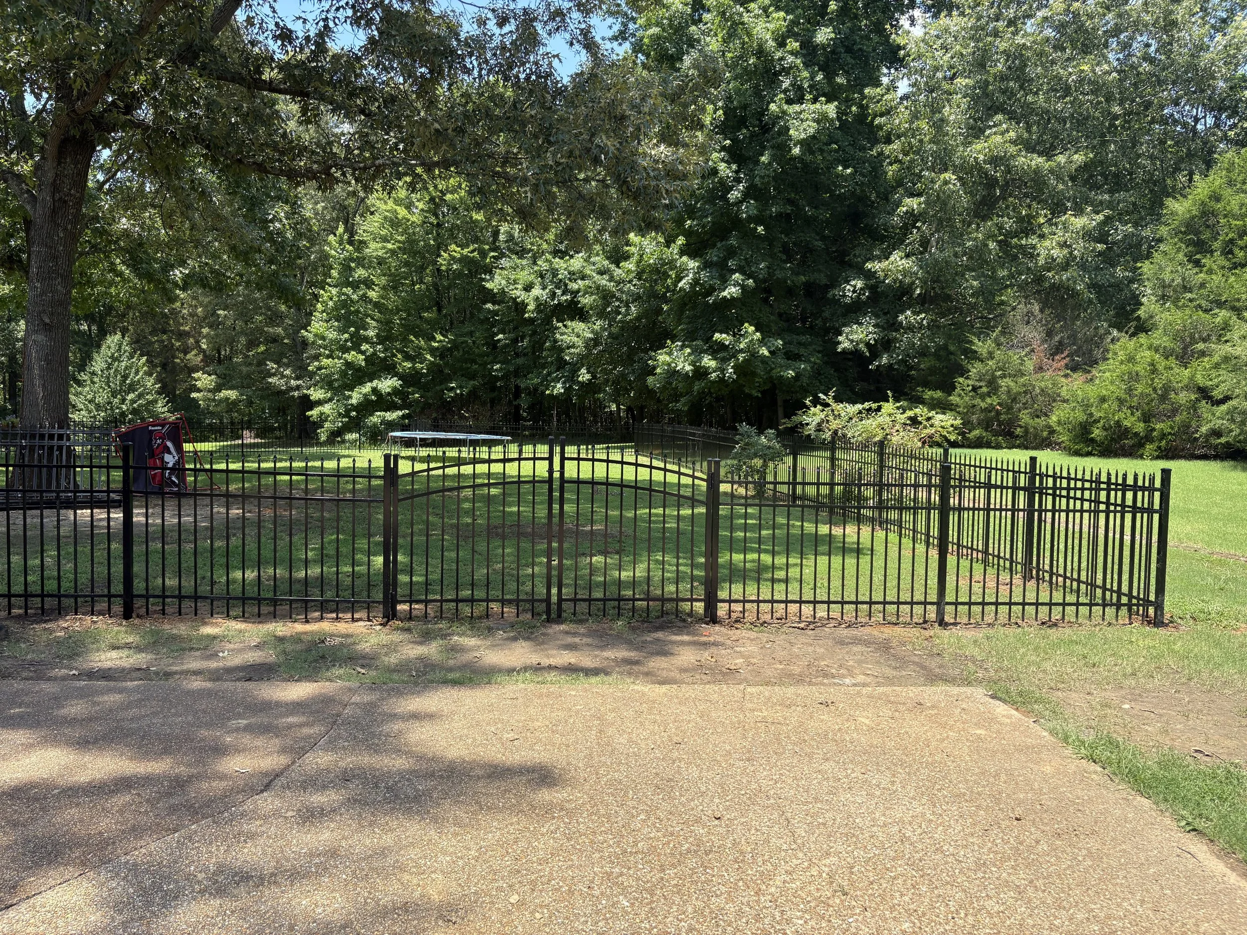 Pressed-top aluminum walk gate with matching residential aluminum fencing installed in Olive Branch, Mississippi by DeSoto Fence Co.