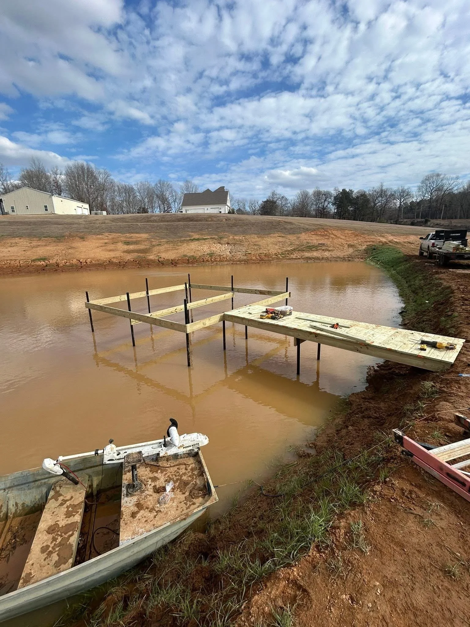 Pond Dock Construction in Nesbit, Mississippi by DeSoto Fence Co. featuring pressure treated lumber, elevated waterfront access, and durable dock construction designed for fishing, recreation, and long term performance.