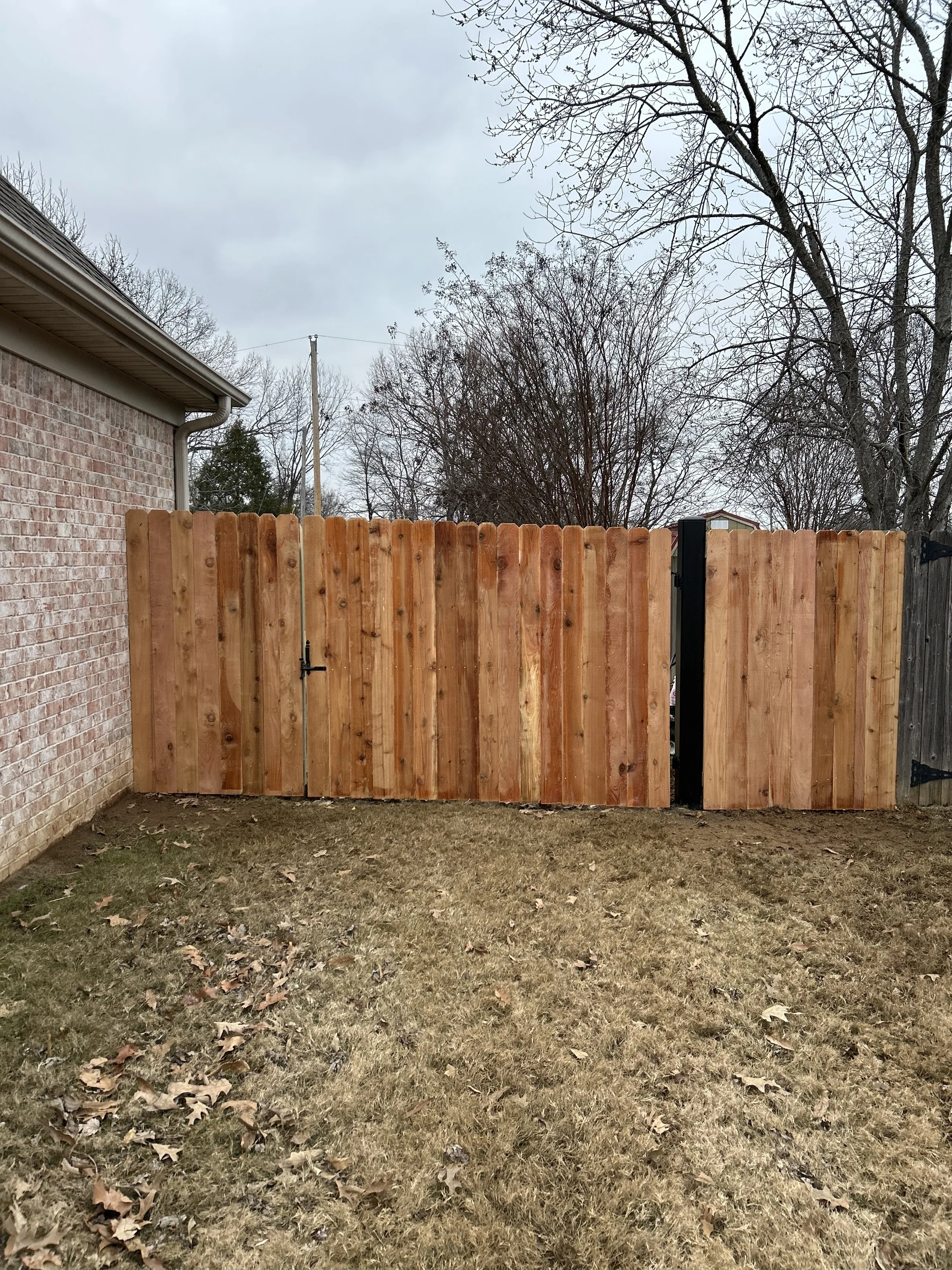 Steel-framed cedar privacy gate built into a cedar privacy fence for long-lasting durability in Hernando, Mississippi.