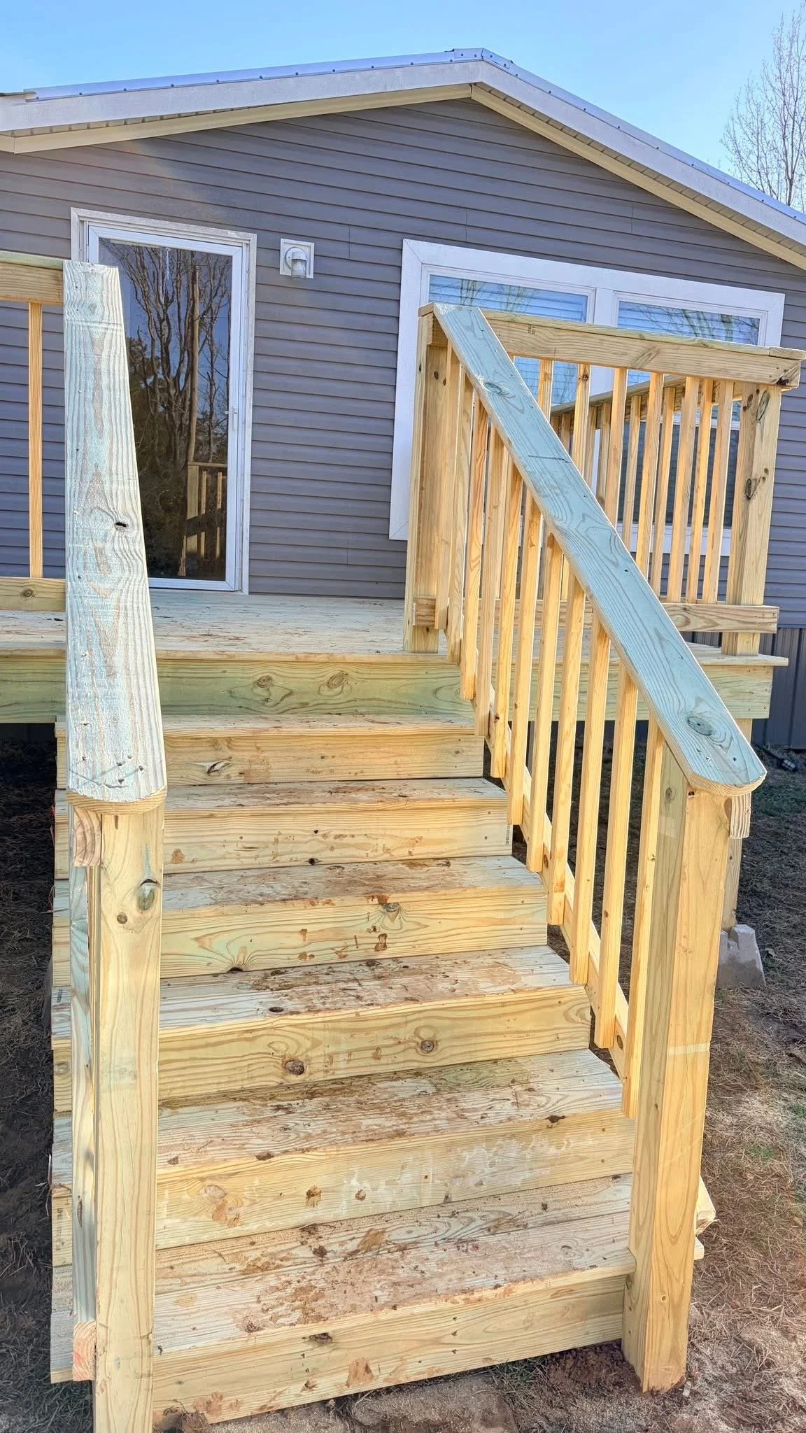 Elevated Wood Deck Builder in Nesbit, MS | Custom Deck Construction with Stairs by DeSoto Fence Co