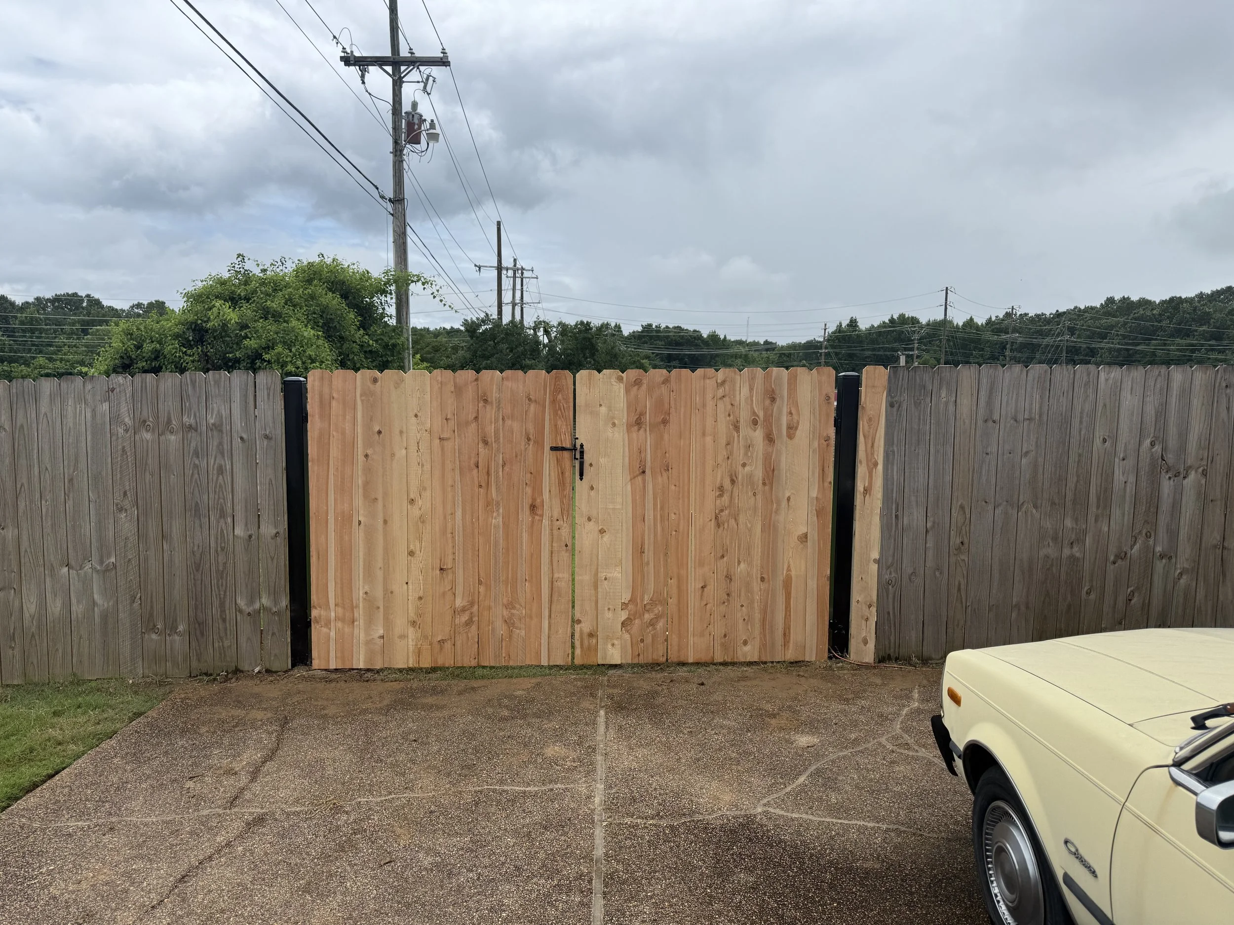 Heavy-duty double steel frame gate featuring premium cedar privacy pickets for long-lasting performance in Southaven, MS. Designed to resist sagging while complementing the beauty and privacy of a custom cedar fence installation.