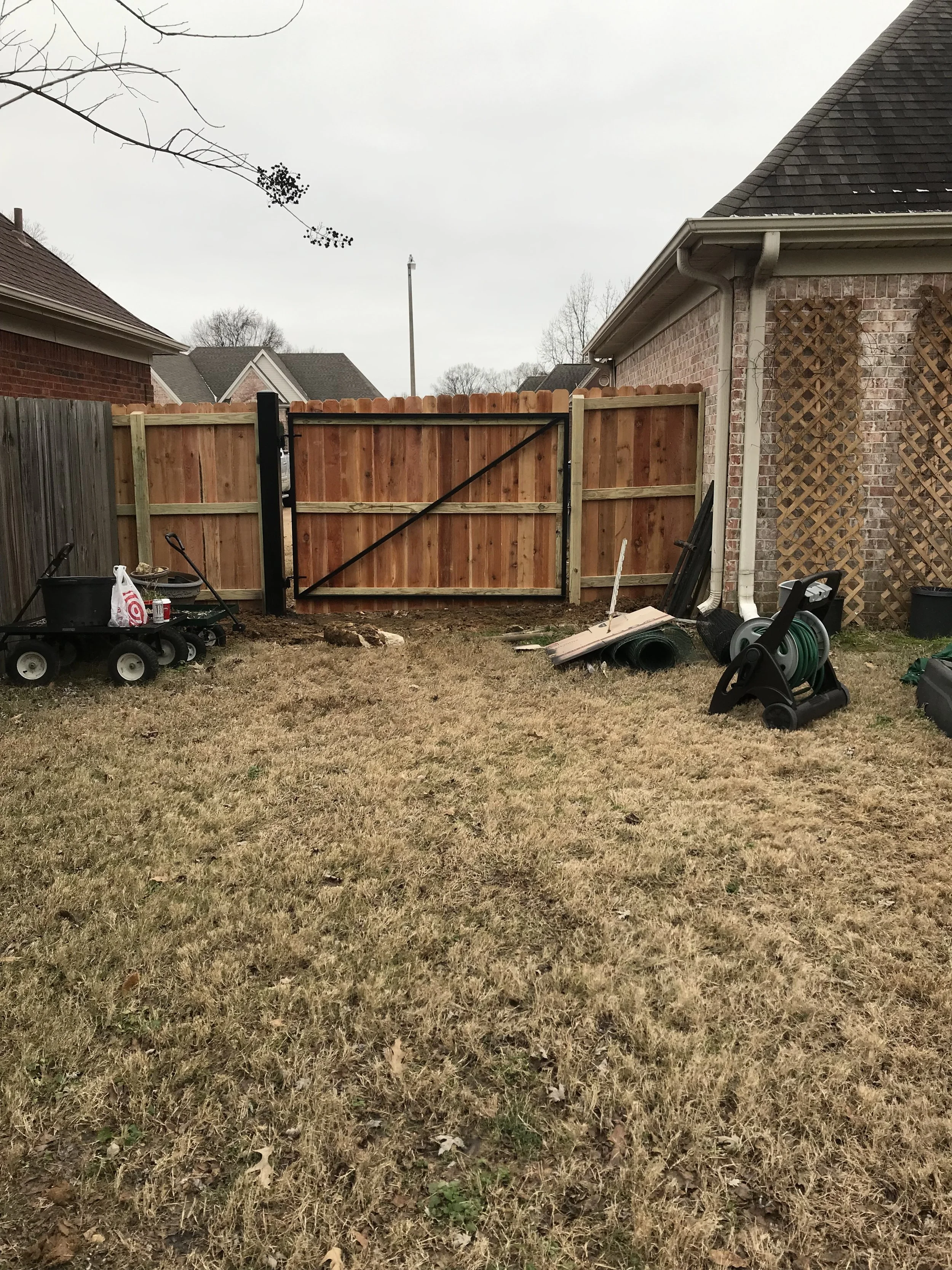 Rear view of a steel-framed cedar privacy gate showing reinforced construction and heavy-duty hardware in Hernando, MS.