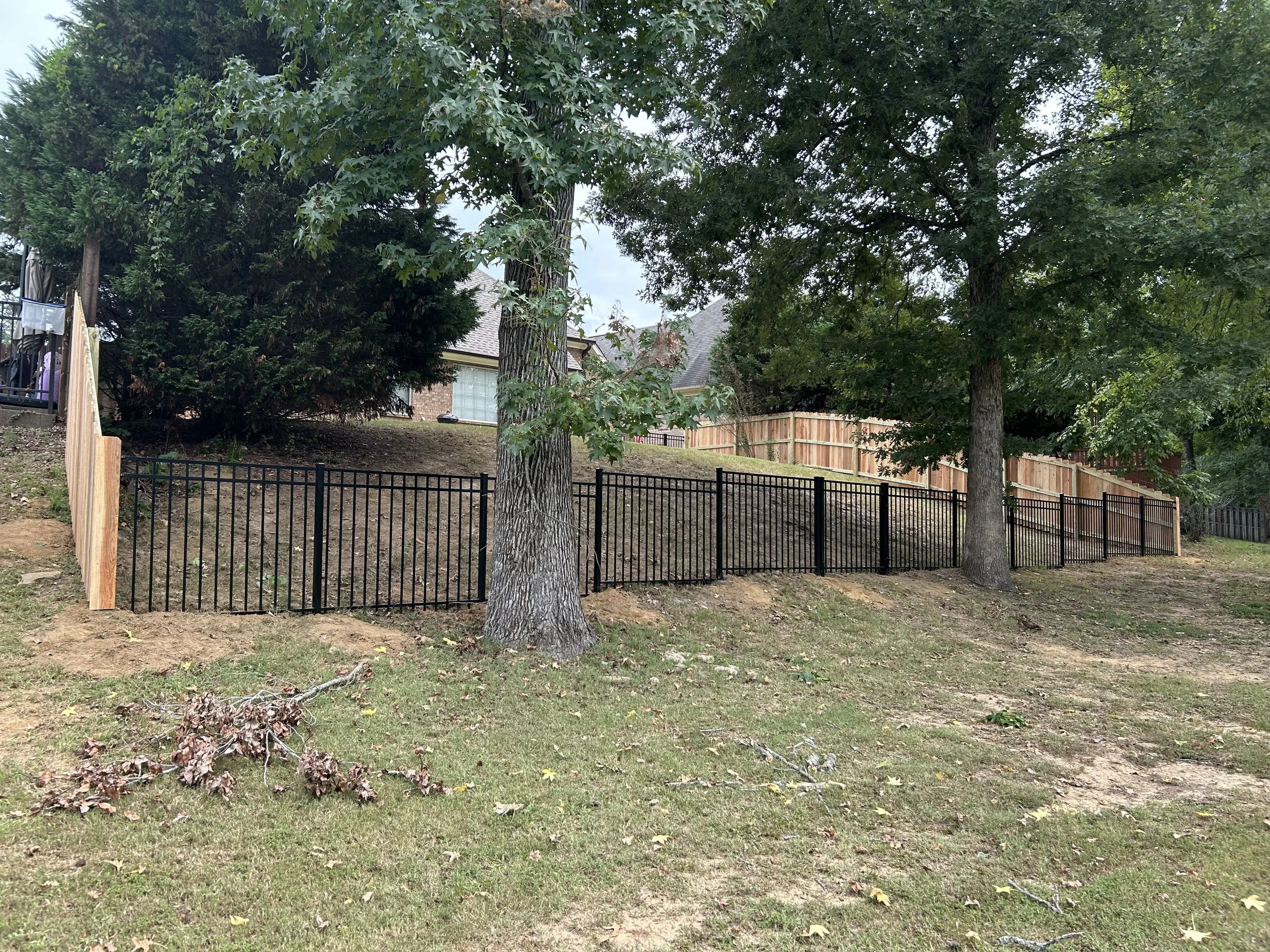 Residential black aluminum fence in Hernando, MS offering an open view of the golf course with durable, low-maintenance protection.