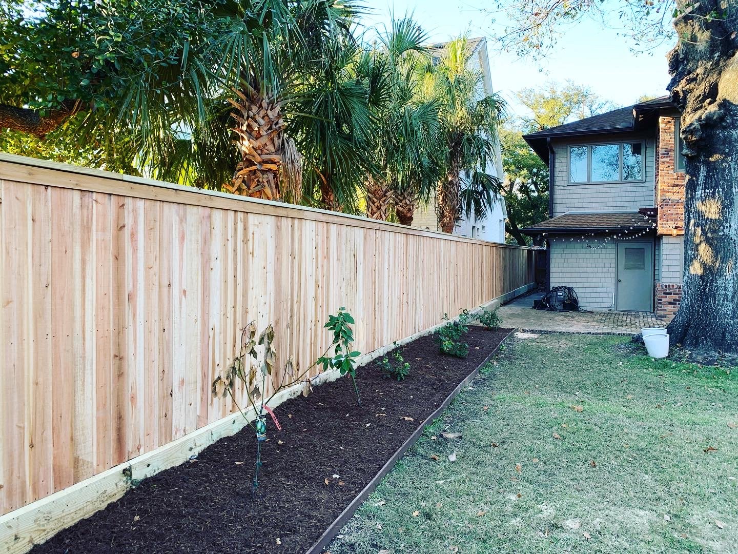 Custom cedar privacy fence installed in Olive Branch, MS by DeSoto Fence Co.