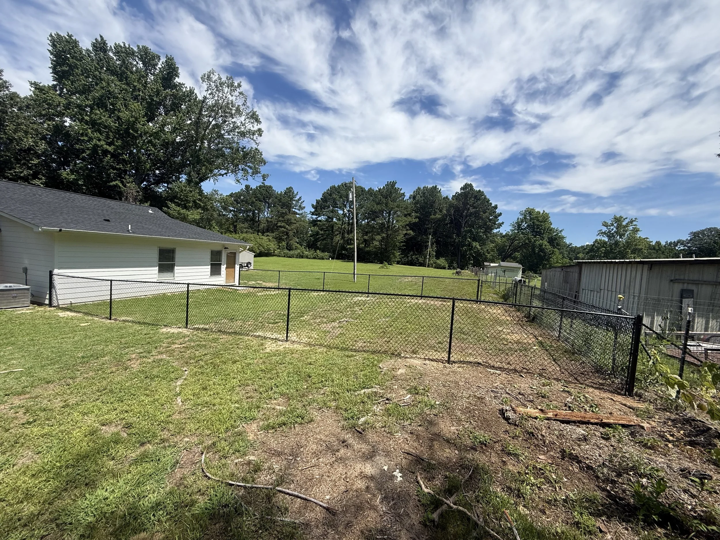 Premium black chain link fence installed in Coldwater, MS for lasting security, pet containment, and a clean, modern appearance by DeSoto Fence Co.
