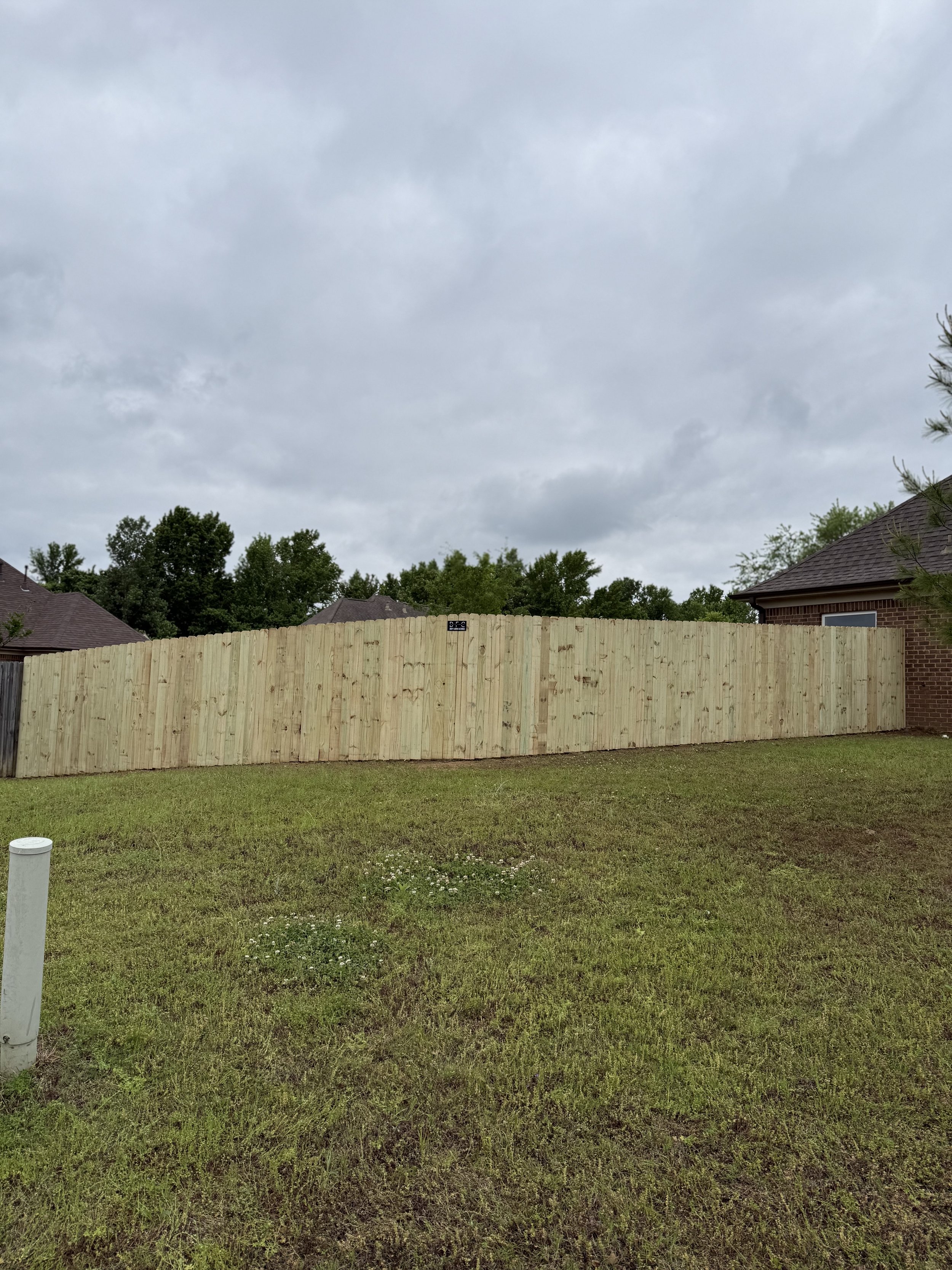 Pressure treated pine privacy fence installed in Southaven, MS by DeSoto Fence Co.