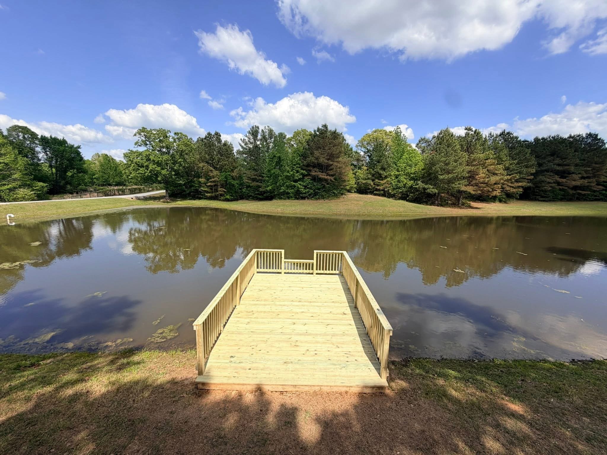 Pressure Treated Floating Dock in Hernando, Mississippi by DeSoto Fence Co. featuring waterfront access, custom railings, and durable dock construction designed for recreation, fishing, and long term performance.