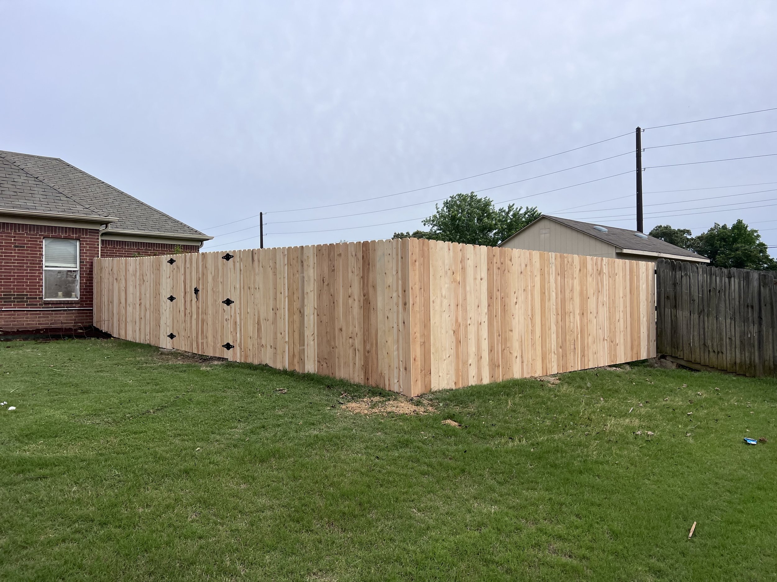 Custom cedar privacy fence installed in Southaven, MS by DeSoto Fence Co.