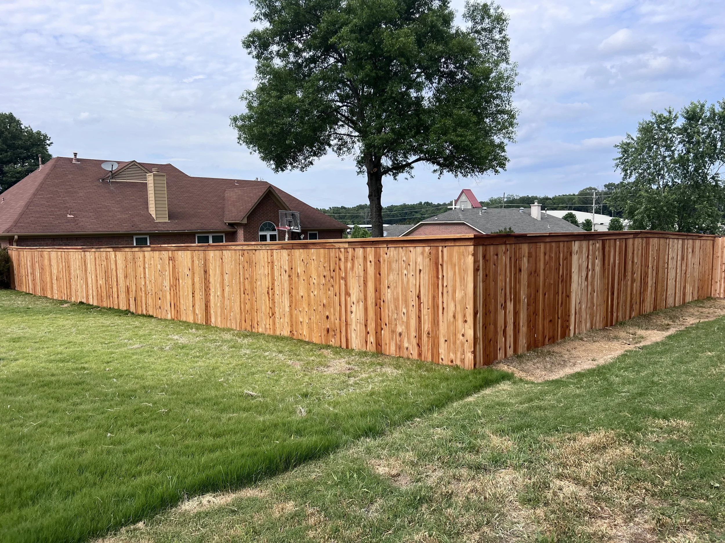Premium cedar privacy fence with water seal built in Olive Branch, MS by DeSoto Fence Co.
