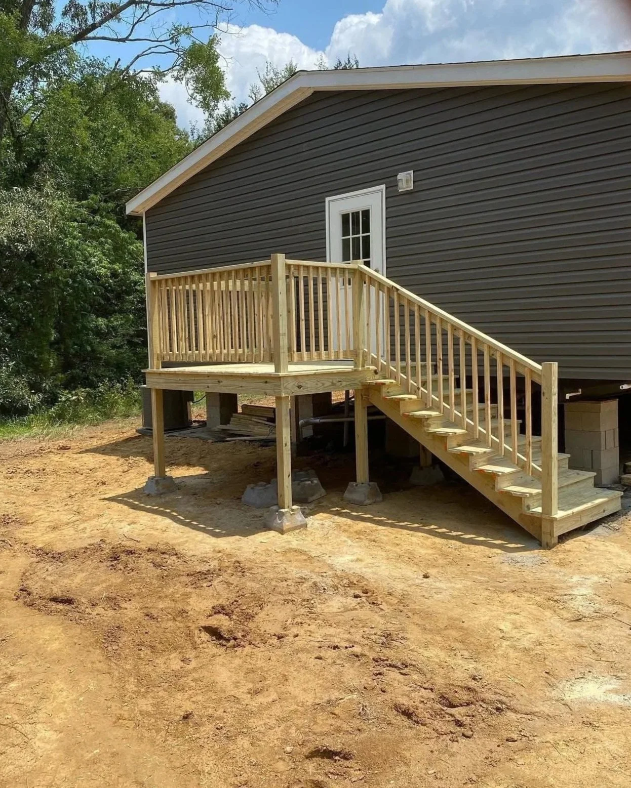 Custom Deck Builder in Olive Branch, MS | Wood Deck Construction with Stairs by DeSoto Fence Co