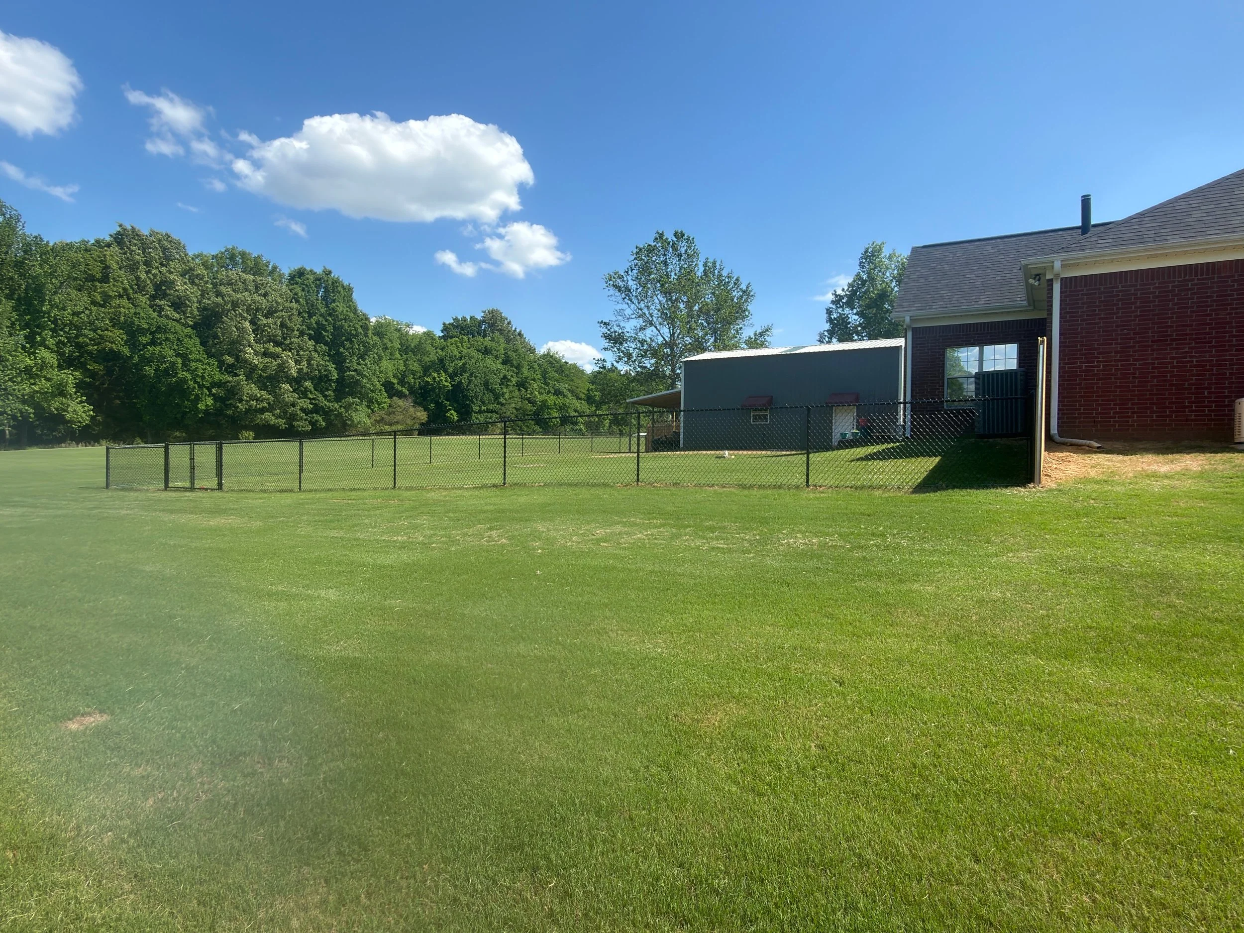 Black chain link fence installed in Hernando, MS by DeSoto Fence Co.