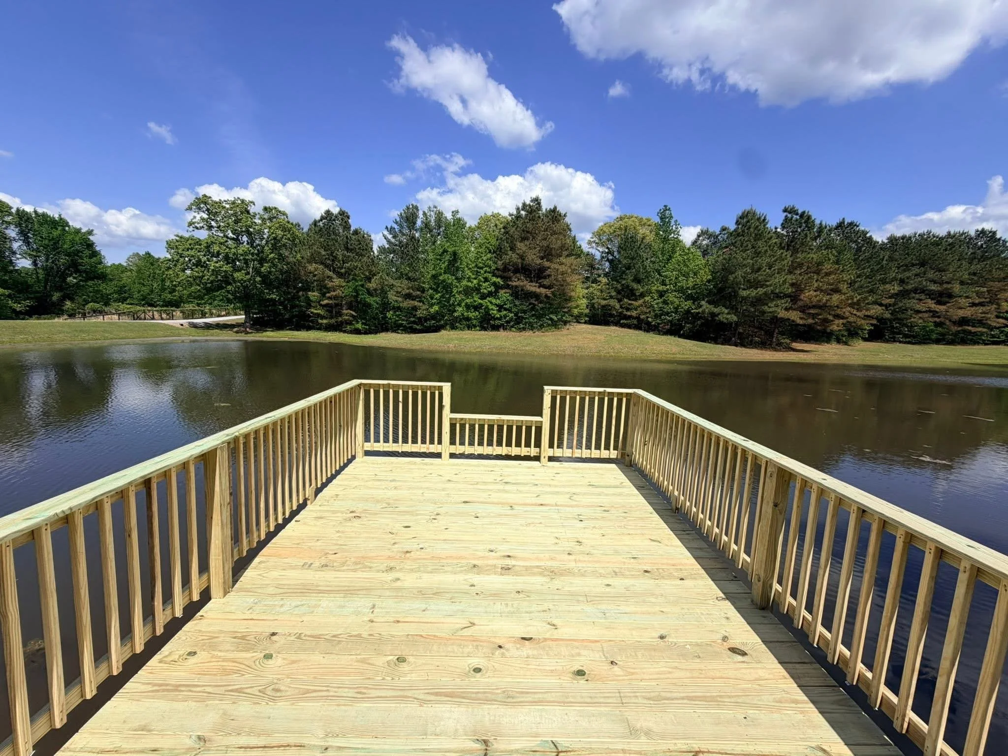 Custom Floating Dock in Nesbit, Mississippi by DeSoto Fence Co. featuring pressure treated lumber, waterfront access, and durable dock construction designed for fishing, boating, and lakeside enjoyment.