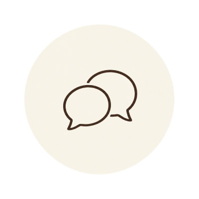 Icon of two overlapping speech bubbles on a light background.