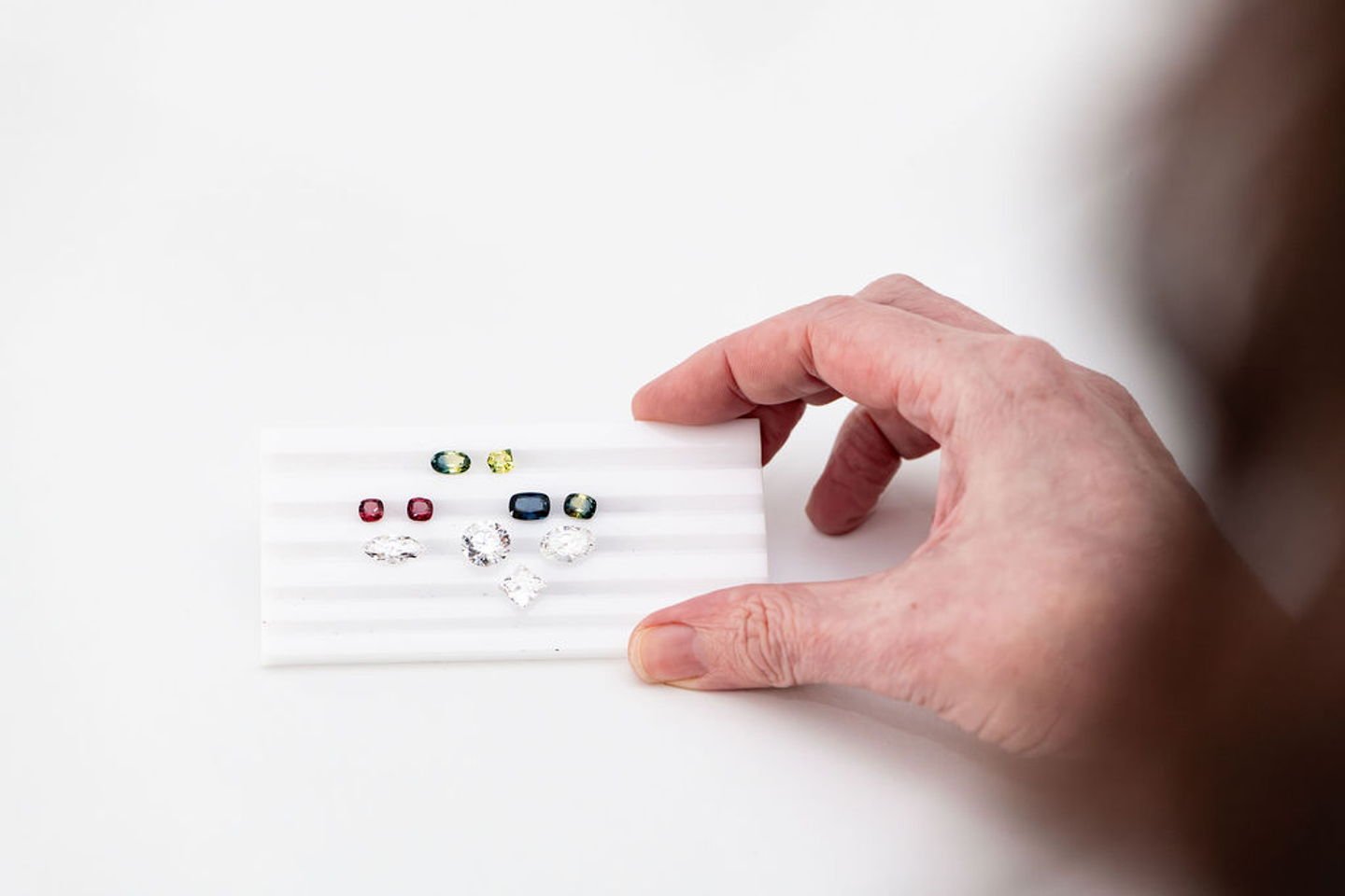 Colour in Sapphire

Sapphire colour comes from trace elements, not from the mineral itself. Corundum is colourless when pure; iron and titanium produce blue, chromium produces pink or red &mdash; which is why ruby and sapphire are the same species. 
