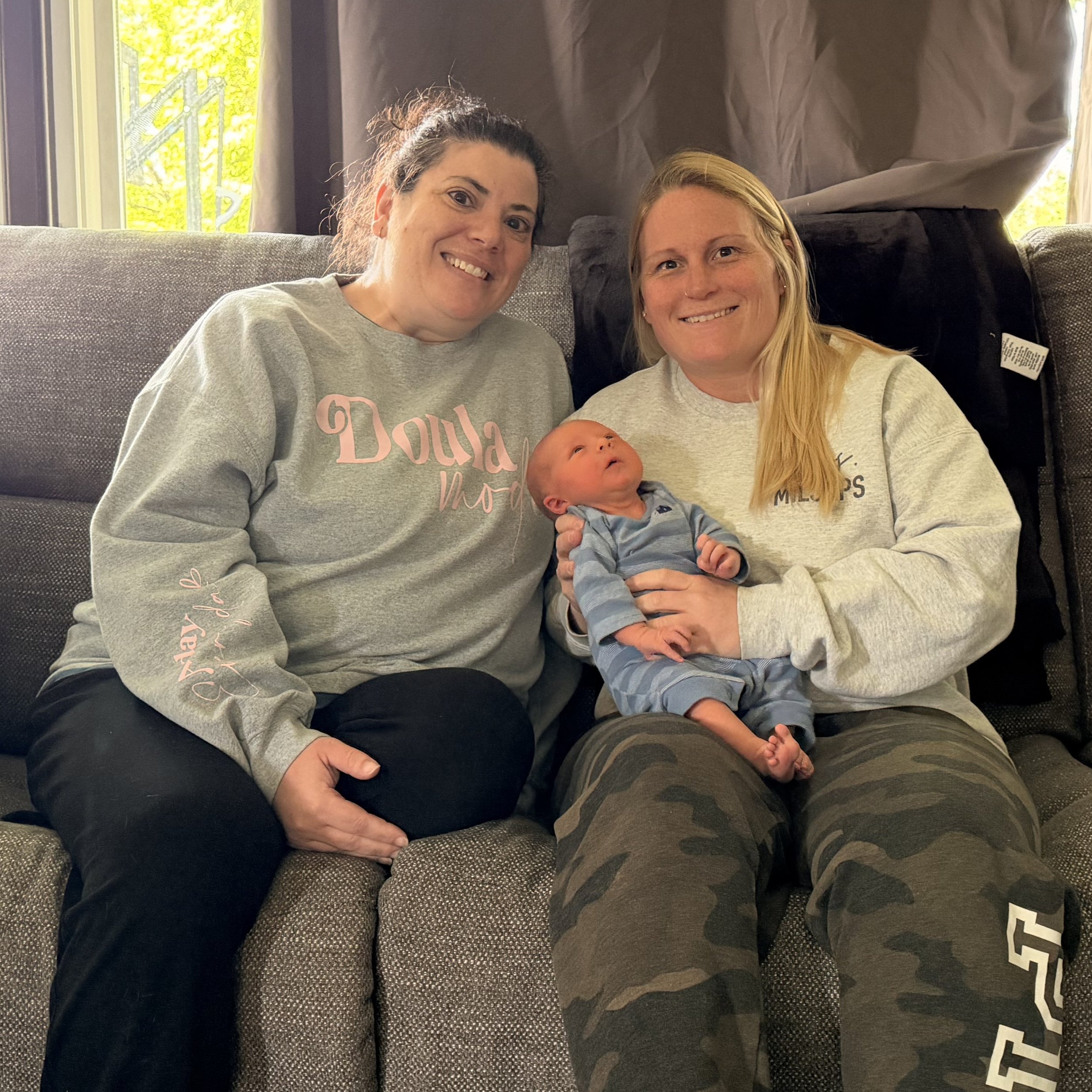Rockford area certified birth doula supporting a birth center birth client during postpartum visit at home.