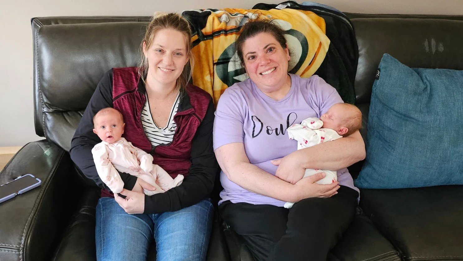 Chicagoland certified birth doula doing a postpartum visit with client following birth of multiple babies in Southeastern Wisconsin at the hospital.