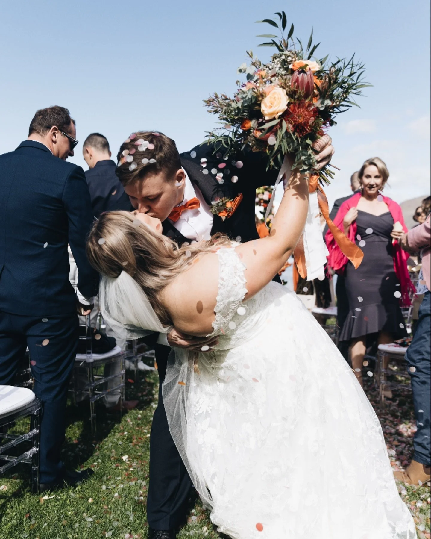 Confetti in the air, love all around! Jordan and William sealing their promises with a kiss as friends and family cheer them on. Moments like these make the day unforgettable.
#JustMarried #QueenstownLove #WeddingMoments #CapturedJoy
