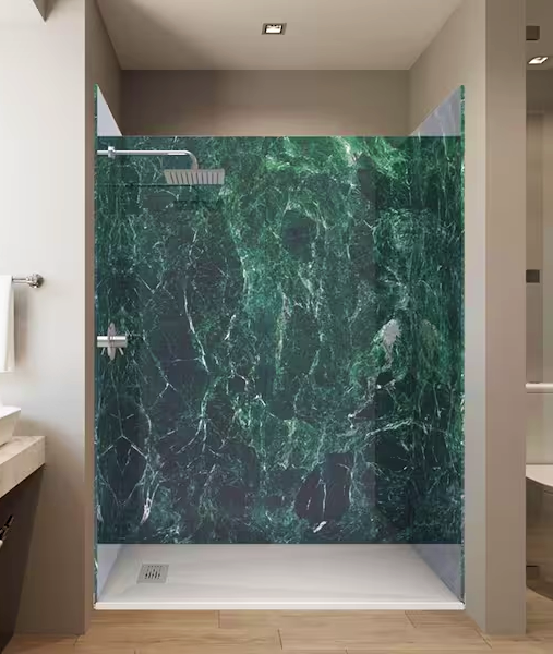 Modern bathroom with a green marble shower interior and glass door.