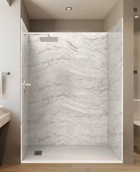 Modern walk-in shower with marble walls, square showerhead, and floor drain.