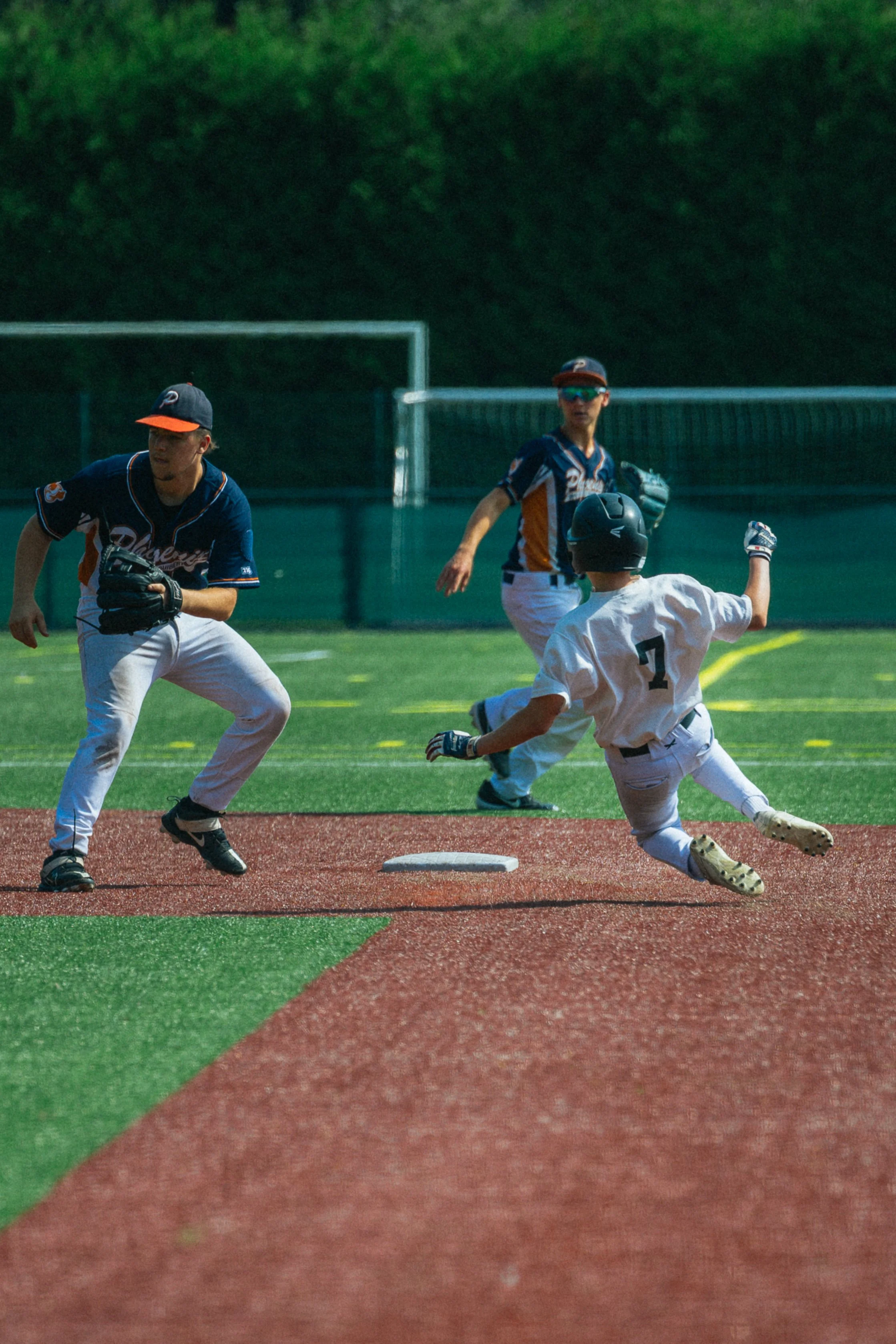 Photo of baseball player sliding to 2nd base