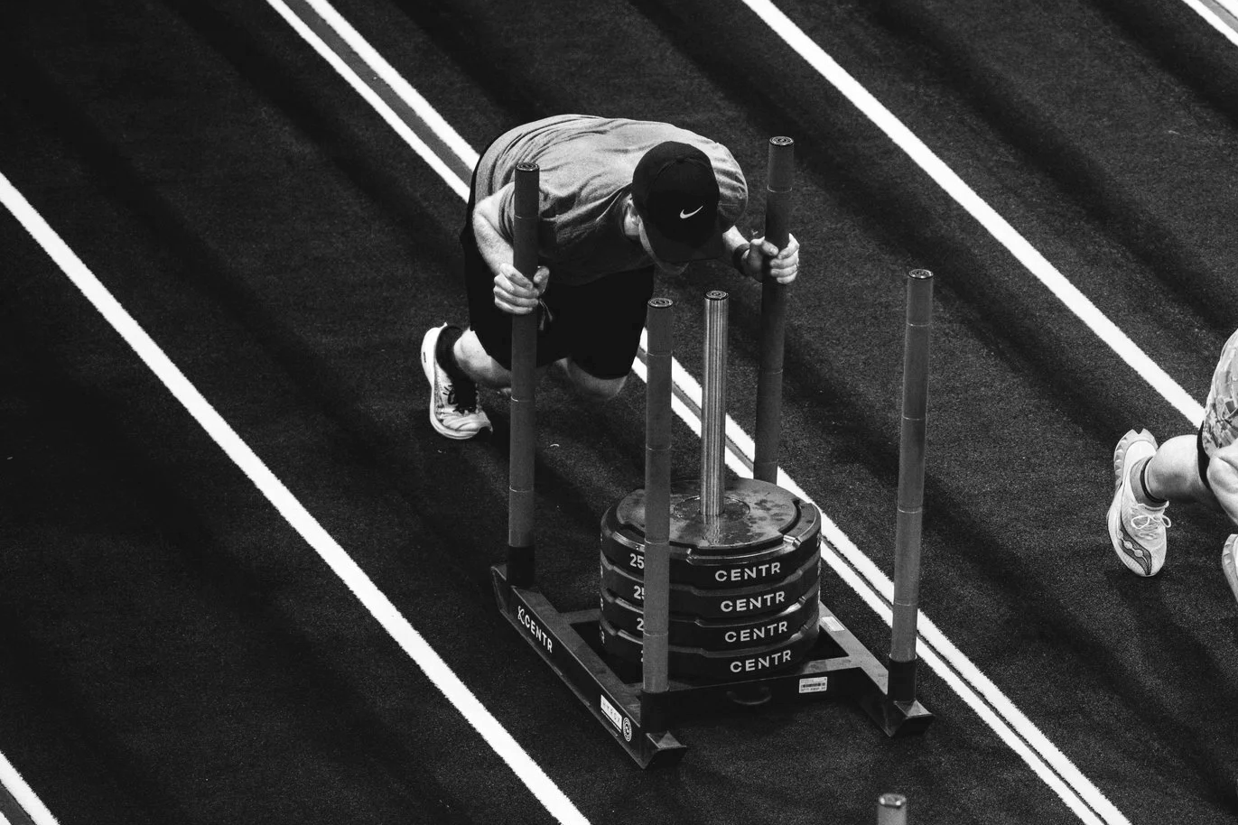 Reactive Hyrox Training Club North Lakes athlete performing a heavy sled push